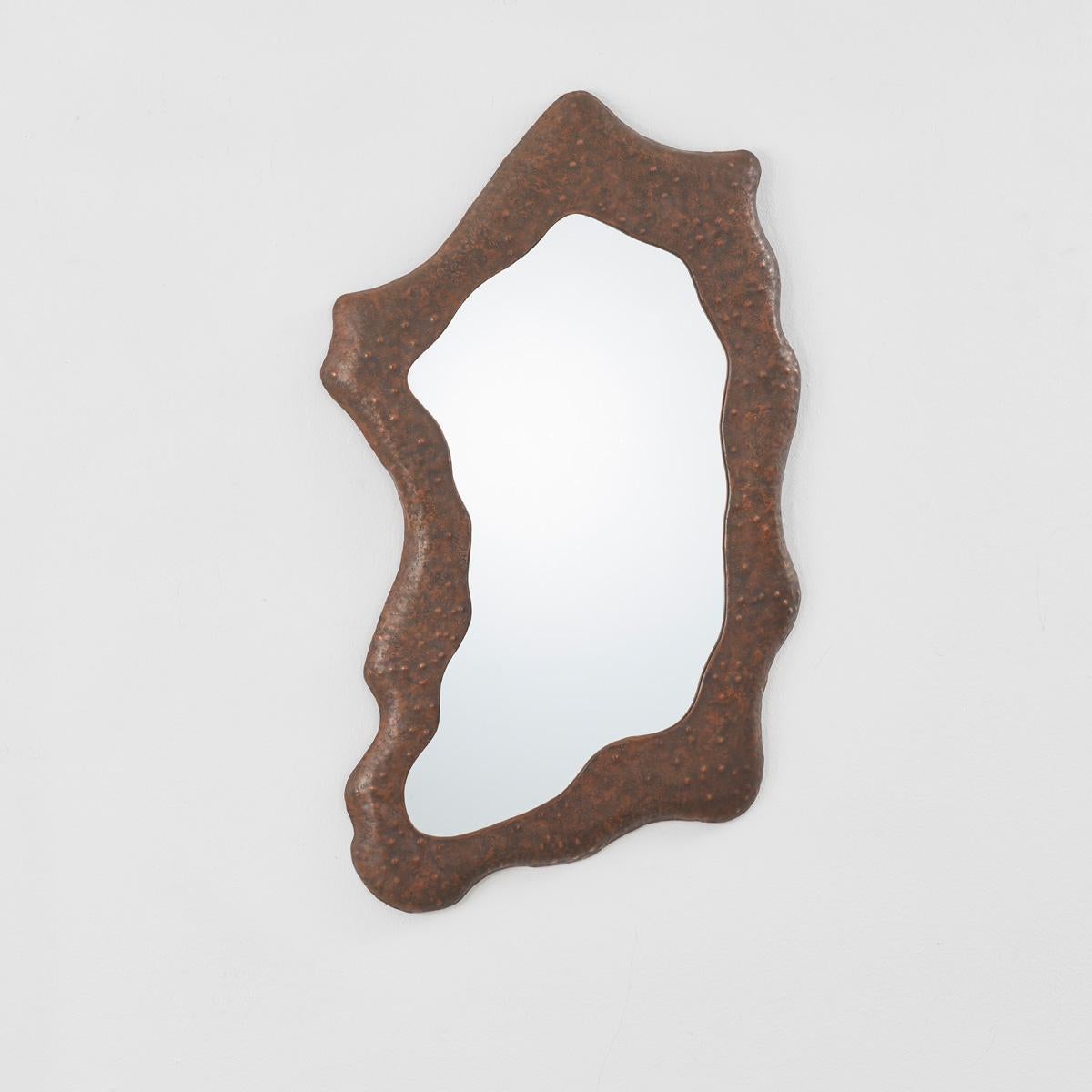 Italian artist and designer Angelo Bragalini, most recognised for his talents as a sculptor, was a technically skilled and acclaimed goldsmith operating independently from his workshop in Bologna, Italy.

This abstract Bragalini mirror has an