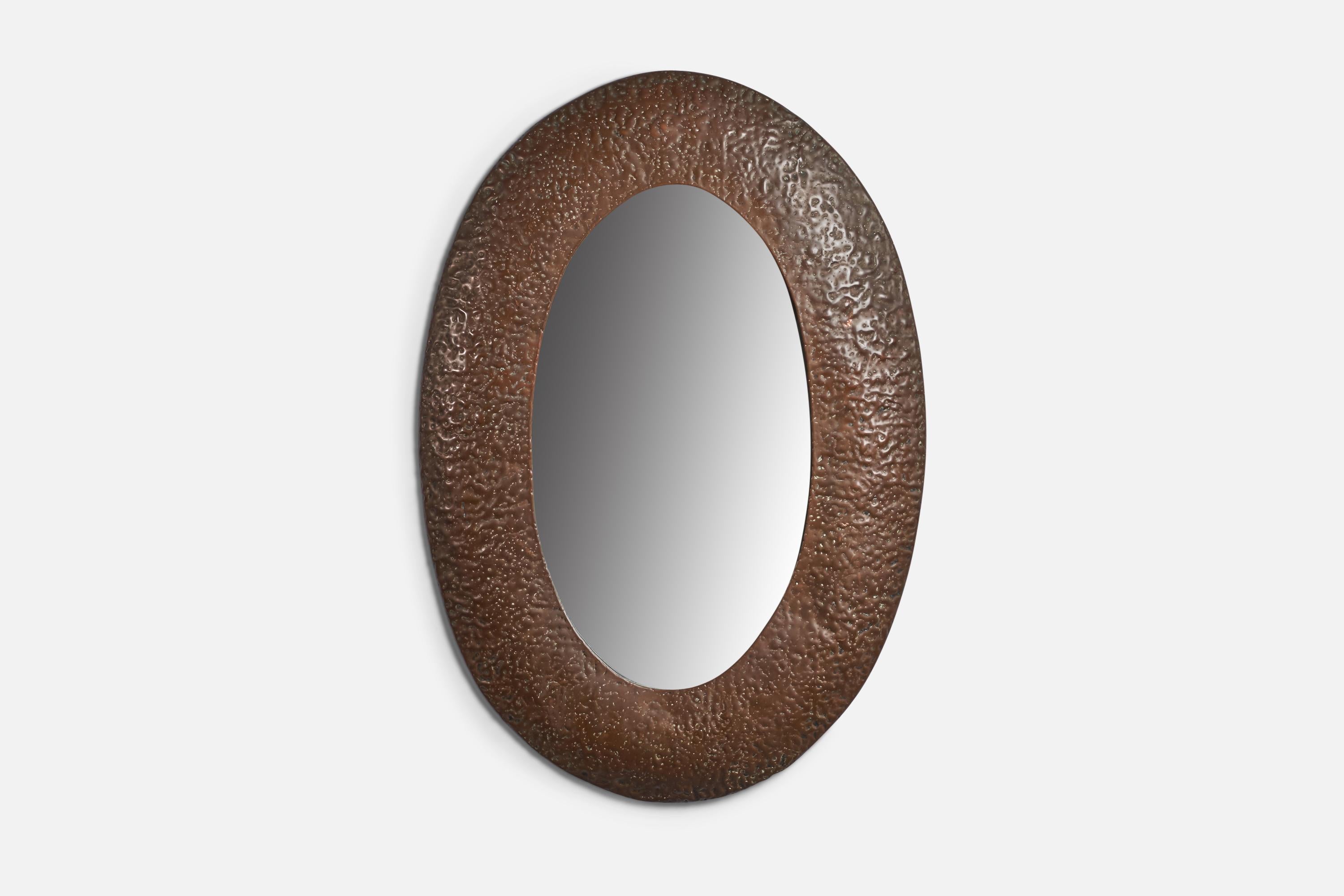 A copper wall mirror with hammered details designed and produced by Angelo Bragalini, Italy, 1960s.
