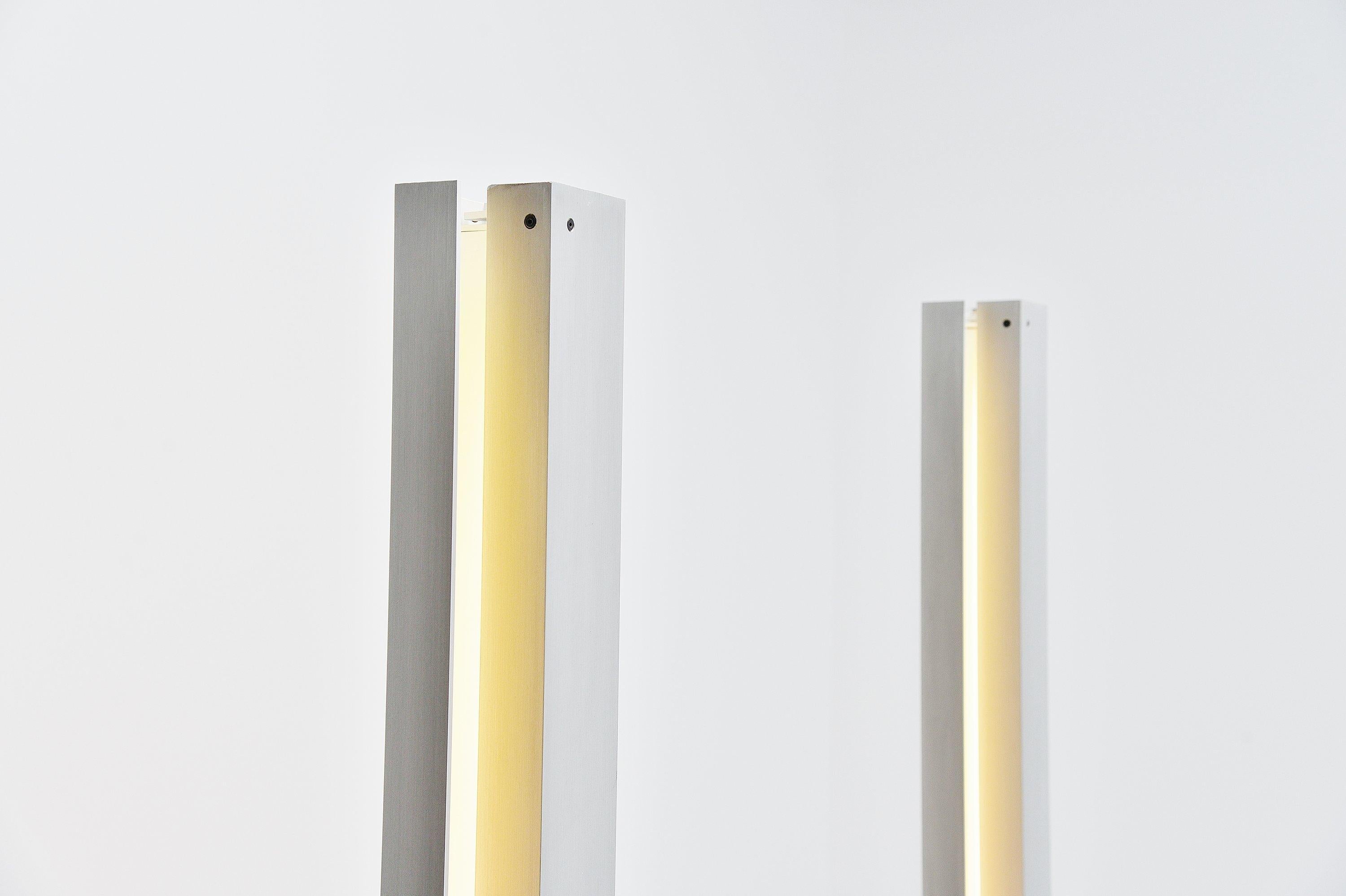 Minimalist floor lamps designed by Angelo Brotto and manufactured by Esperia, Italy, 1971. The floor lamps are made of aluminium tubular adjustable frames for different light positioning and the base is made of weighted metal, black painted.