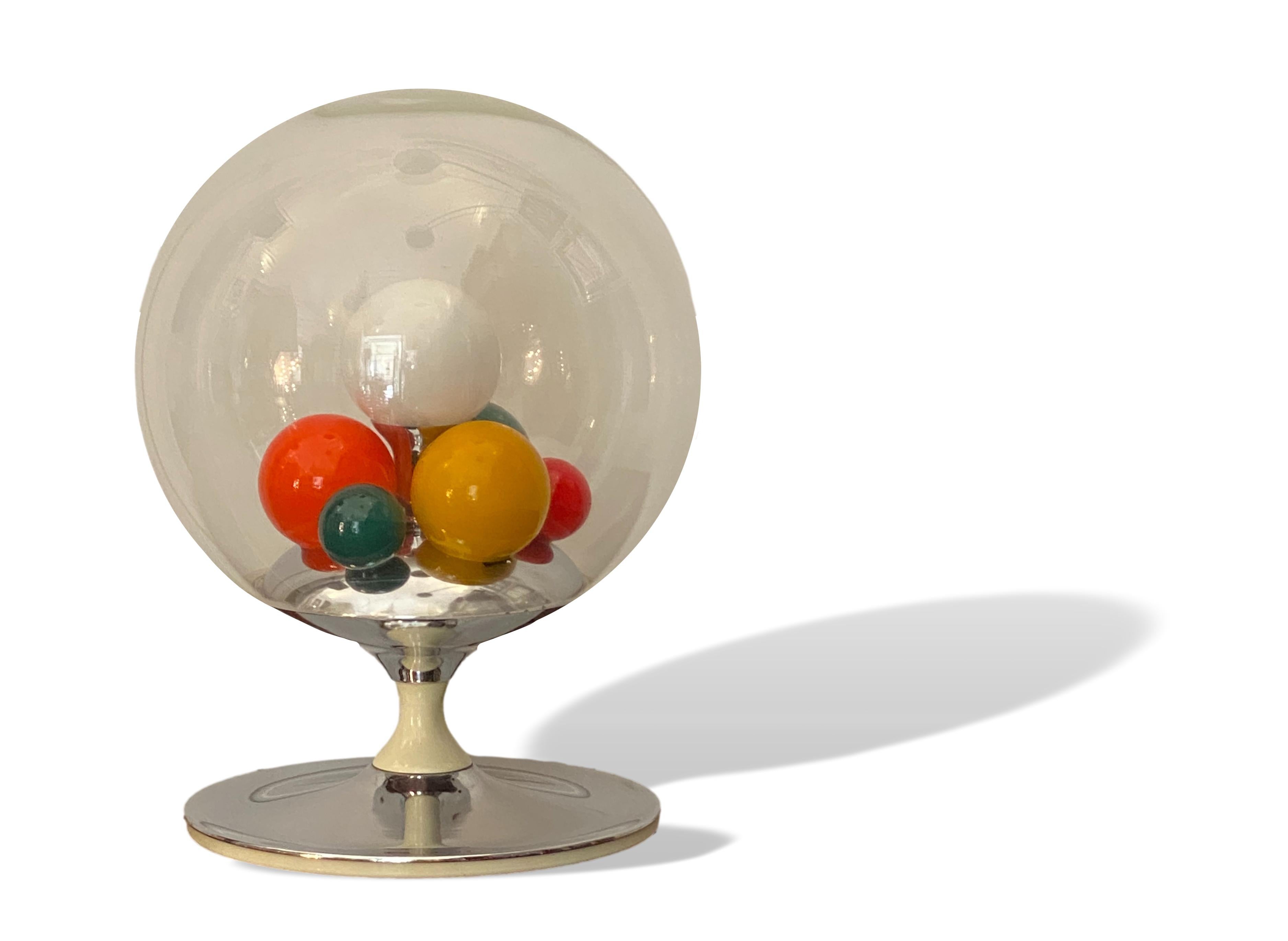 Fantastic table lamp Mod. Barbarella Design Angelo Brotto, Production Esperia Italy 1960 - 1969
Base in chromed metal, cap in leaded glass slightly satinized, colored glass.
Inside 7 spheres, 6 colored and one big white central one. The white