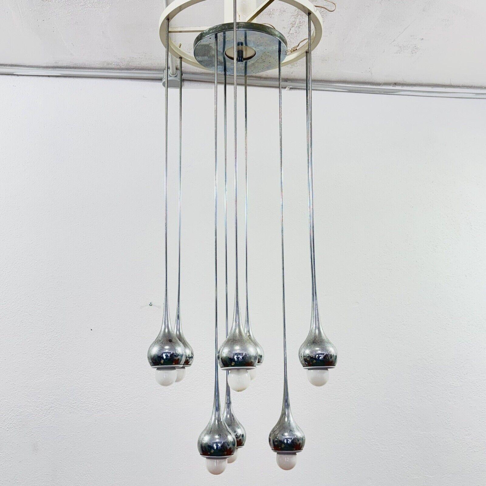 Angelo Brotto Esperia Lampadario 9 Luci Design Modernariato 1970.

Struttura interamente in metallo, braccia in acciaio cromato.

L'articolo è in buone condizioni conservative, non vi è alcun difetto estetico o strutturale importante da segnalare,