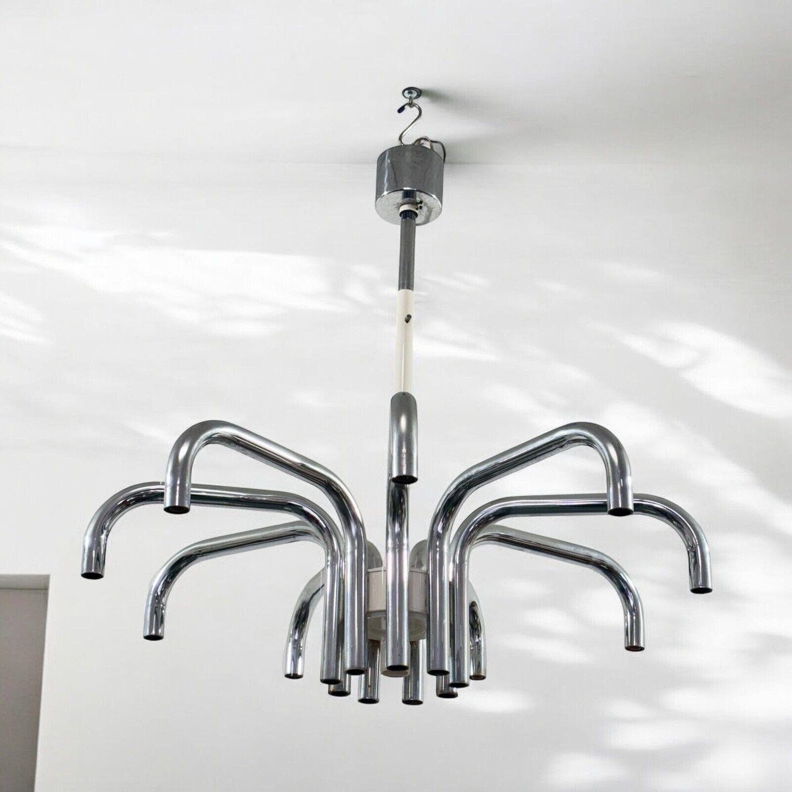 Angelo Brotto Esperia Luci Lampadario 19 Luci Design Modernariato.

Struttura interamente in acciaio cromato tubolare.

L’articolo è in ottime condizioni conservative, non vi è alcun difetto estetico o strutturale importante da segnalare, solo lievi