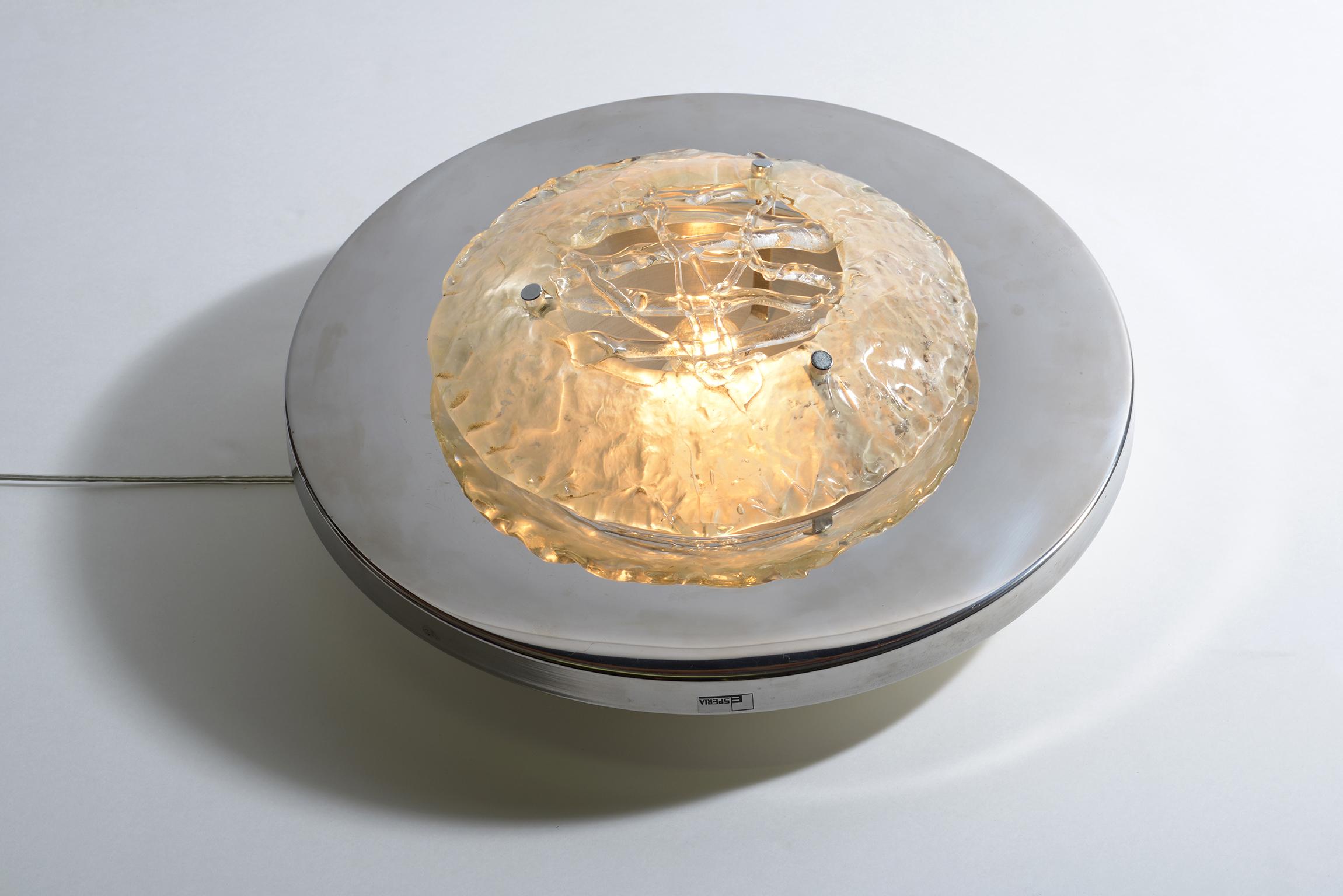 Round chromed metal structures supports in the central part a Murano no color glasses.
This ceiling lights designed in the 1970 by Angelo Brotto end produced by Esperia are signed with the original labels of the manufacture and could be mounted
