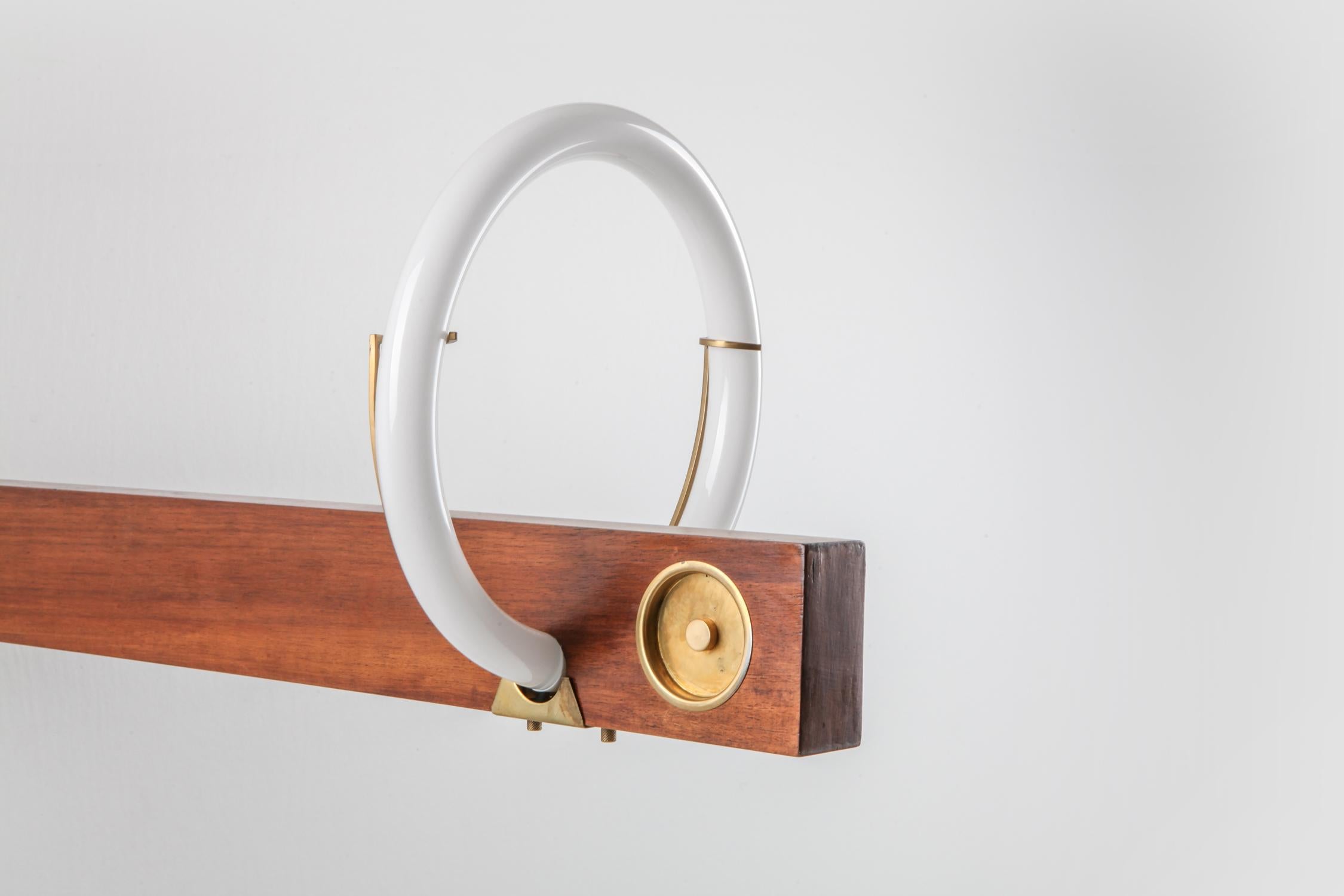 Italian Angelo Brotto neon wall light in walnut and brass For Sale