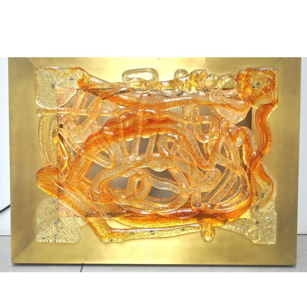 From late 1960s large sculptural sconce like a painting back lighted in golden aluminum in multi-color Murano glass by Angelo Brotto for Esperia.
BORN IN VENICE IN 1914 AND PASSED AWAY IN CAMPIGLIA MARITTIMA IN 2002 AS ANGELO BROTTO.
PROF. BROTTO