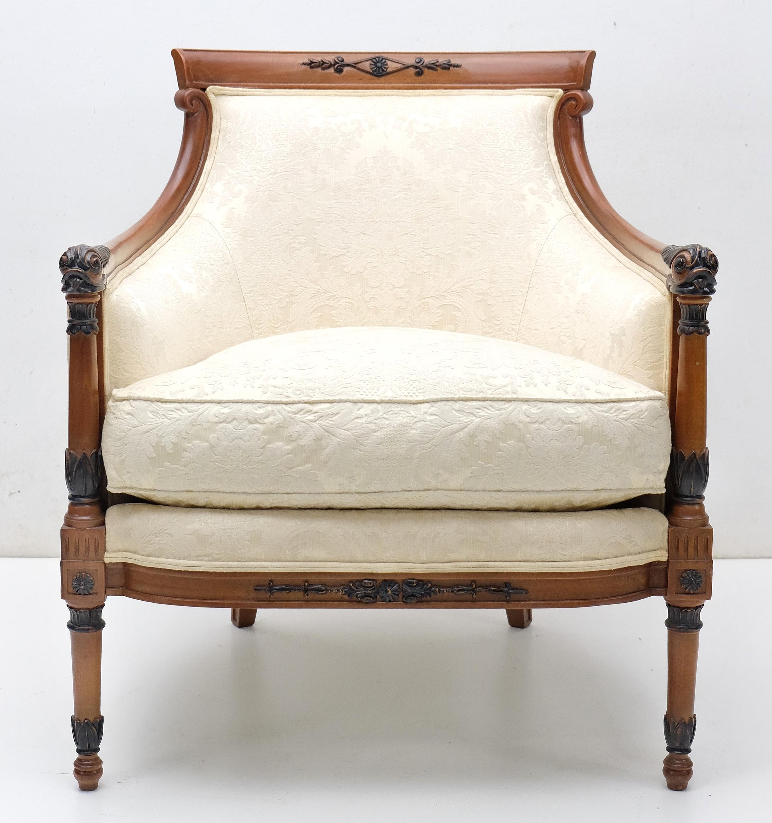 Angelo Cappellini Bergere Armchair

Offered for sale is an upholstered and classical styled bergere armchair from Angelo Cappellini.
The chair is supported by a finely carved wood frame on thin carved legs with stiff armrests. Made of solid wood and
