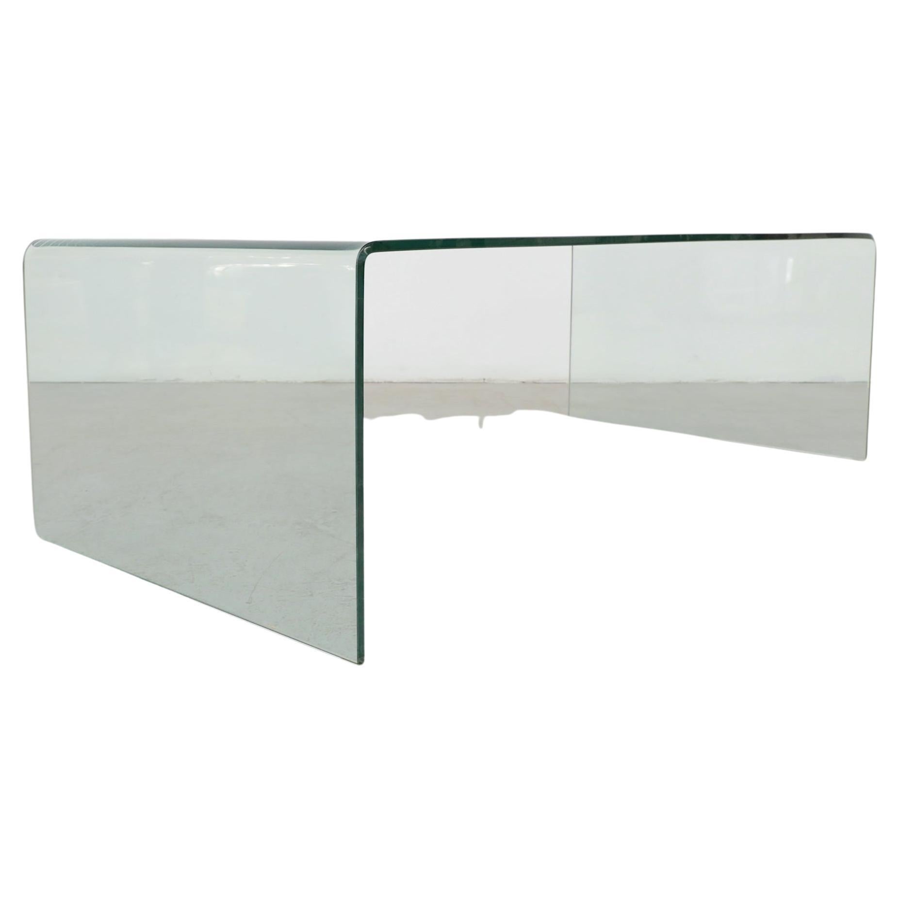 Angelo Cortesi (attr) 1980s glass waterfall coffee table, for Fiam Italia. The coffee table is made from one continuous piece of slumped glass. In original condition with some chipping to the bottom corners and light scratching on the top surface.