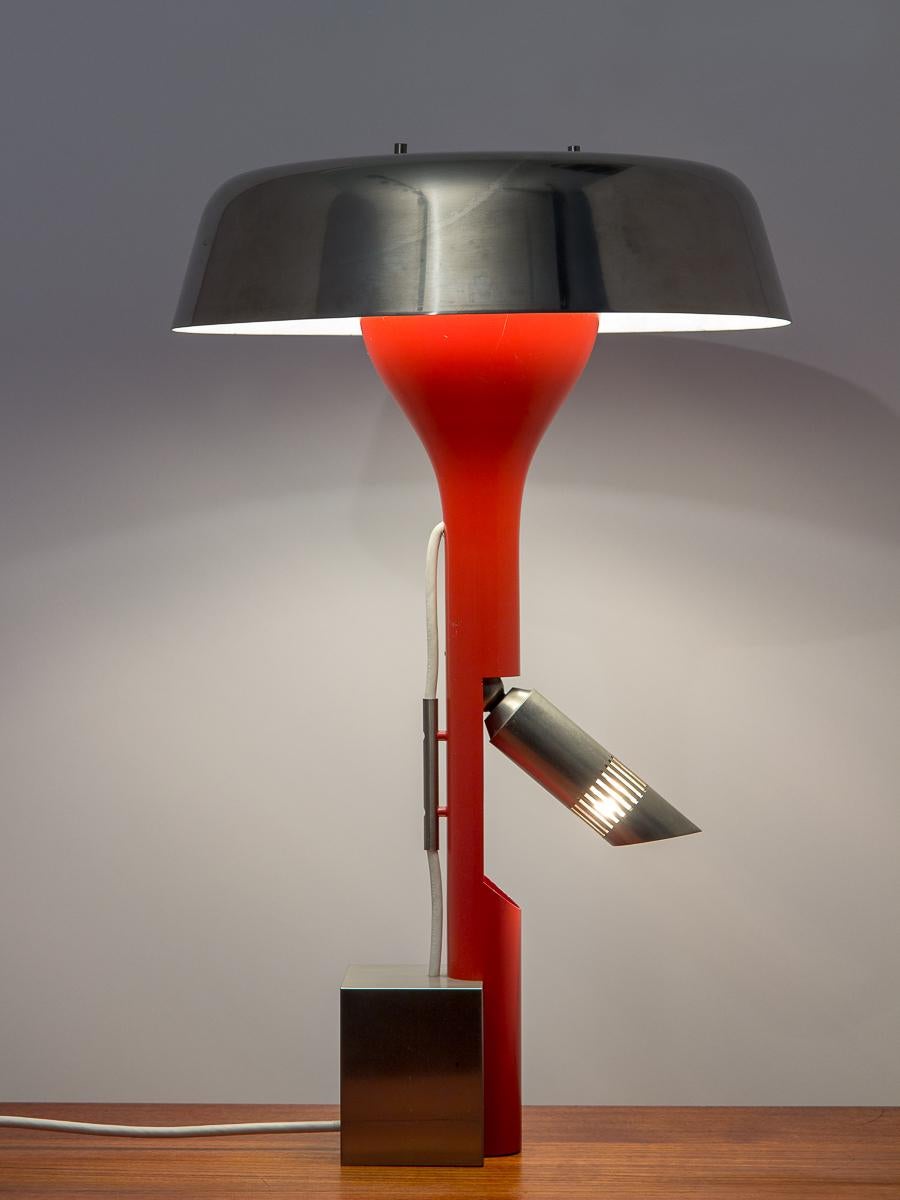 Rare adjustable table lamp, designed by Angelo Lelii for Arredoluce. Industrial in its essence, the design emphasizes the mechanical lighting components of the lamp. A dynamic lighting solution, the lamp is wired for three stages of