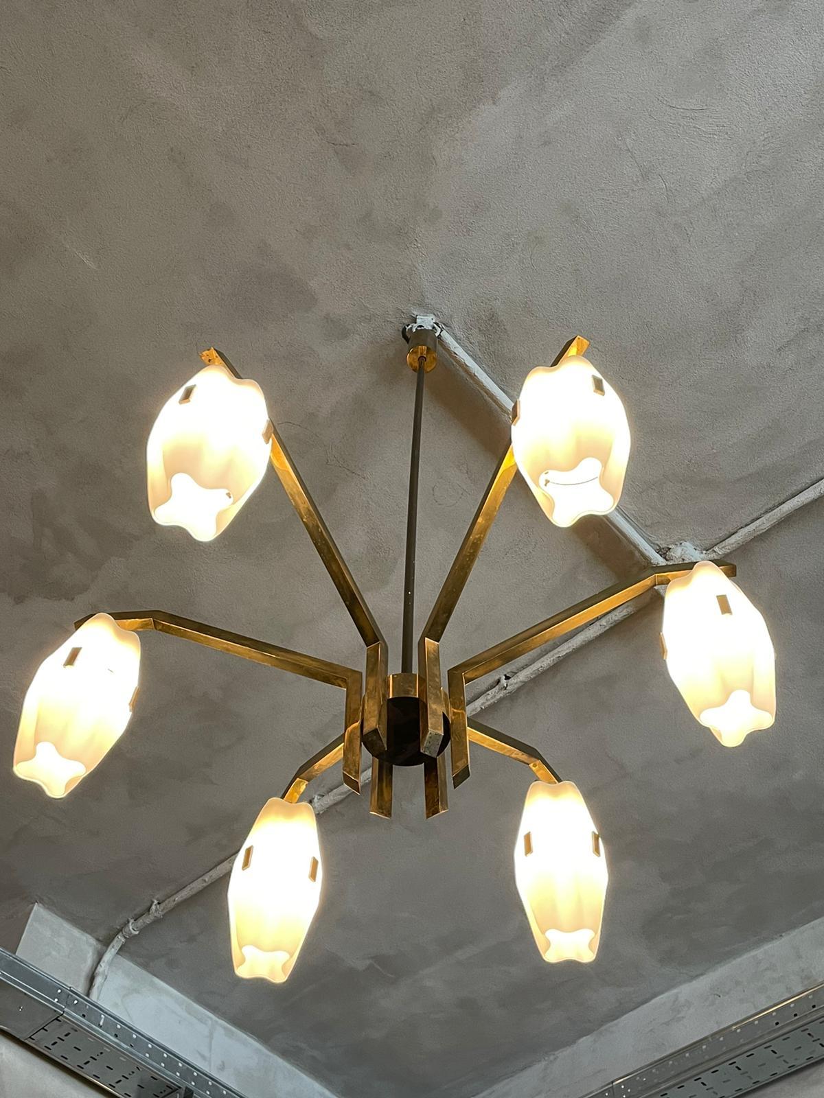 Chandelier mod. 12780 of Angelo Lelii for Arredoluce, Italy, 1959.
Structure in polished brass, diffusers in duplex white opal glass.
Excellent vintage patina.

References: Anty Pansera, Alessandro Padoan, Alessandro Palmaghini “ARREDOLUCE,