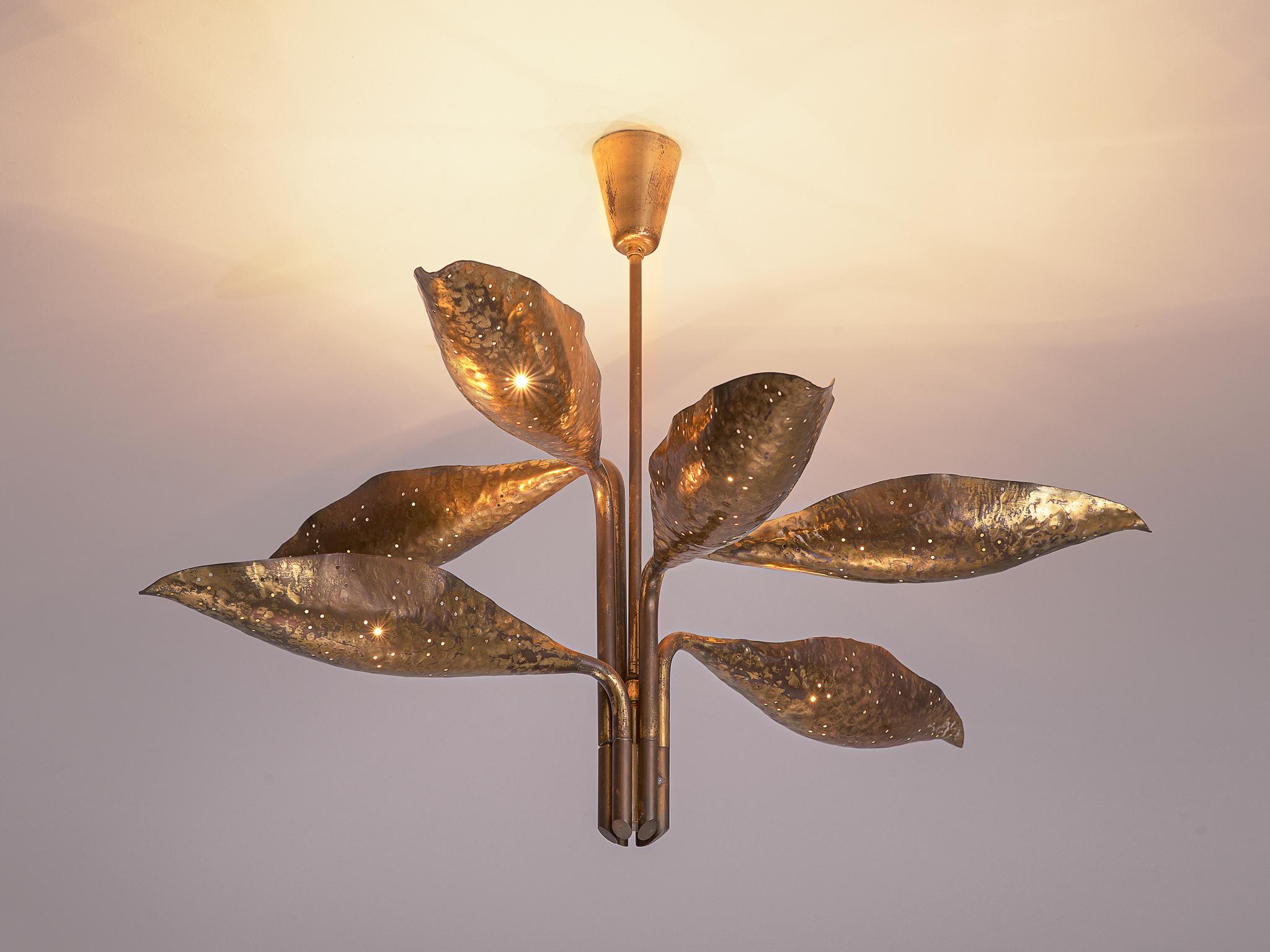 Angelo Lelii for Arredoluce, chandelier, brass and metal, Italy, 1950s.

This elegant and organic pendant with admirable patinated brass hand-hammered leafs is designed by Angelo Lelli. The chandelier consists of a brass shaft from which six brass