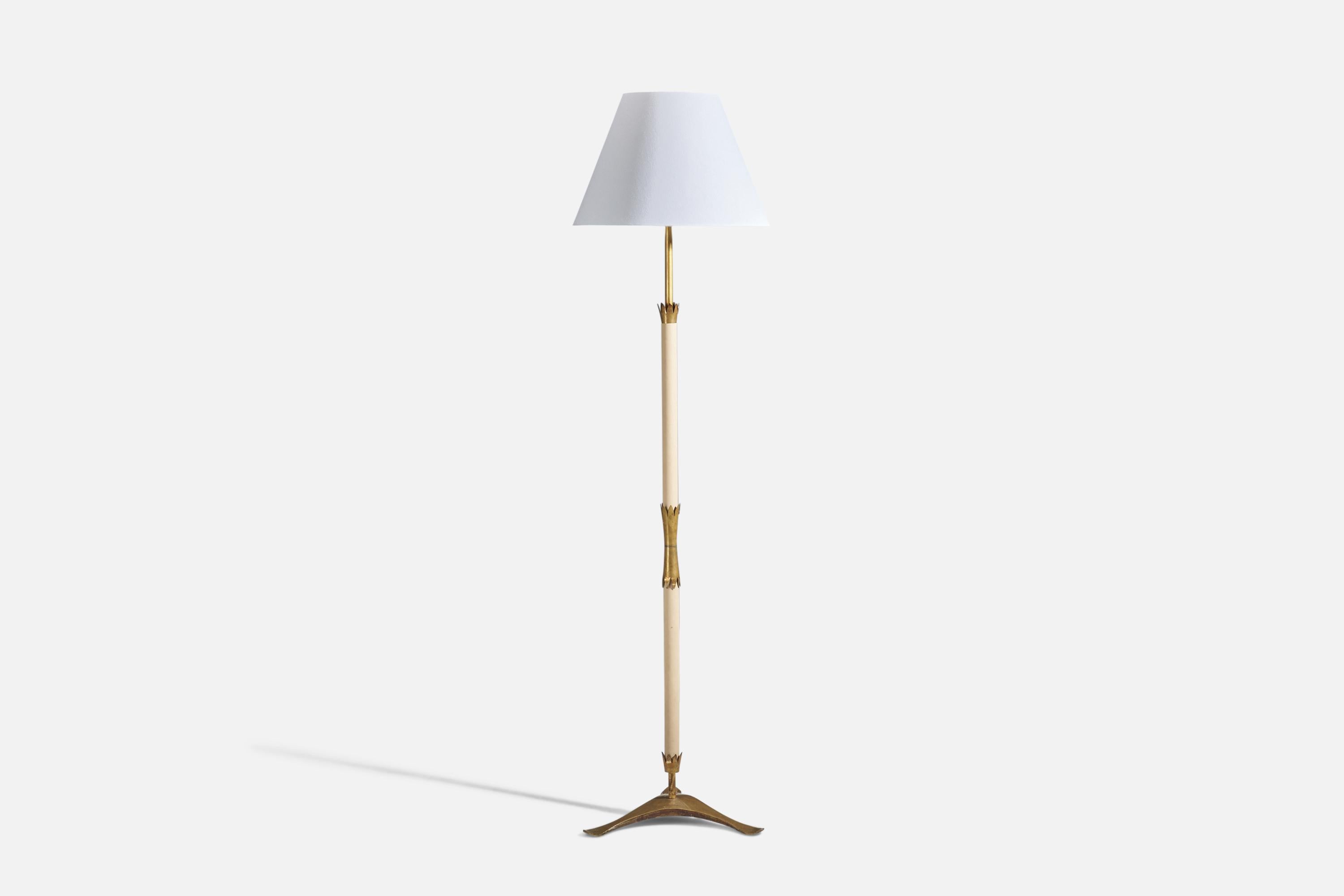 A brass, leatherette, marble and fabric floor lamp designed by Angelo Lelii and produced by Arredoluce, Italy, c. 1955. 

Sold with Lampshade. Dimensions stated are of Floor Lamp with Lampshade. 

Sockets take standard E-26 medium base bulbs.

There