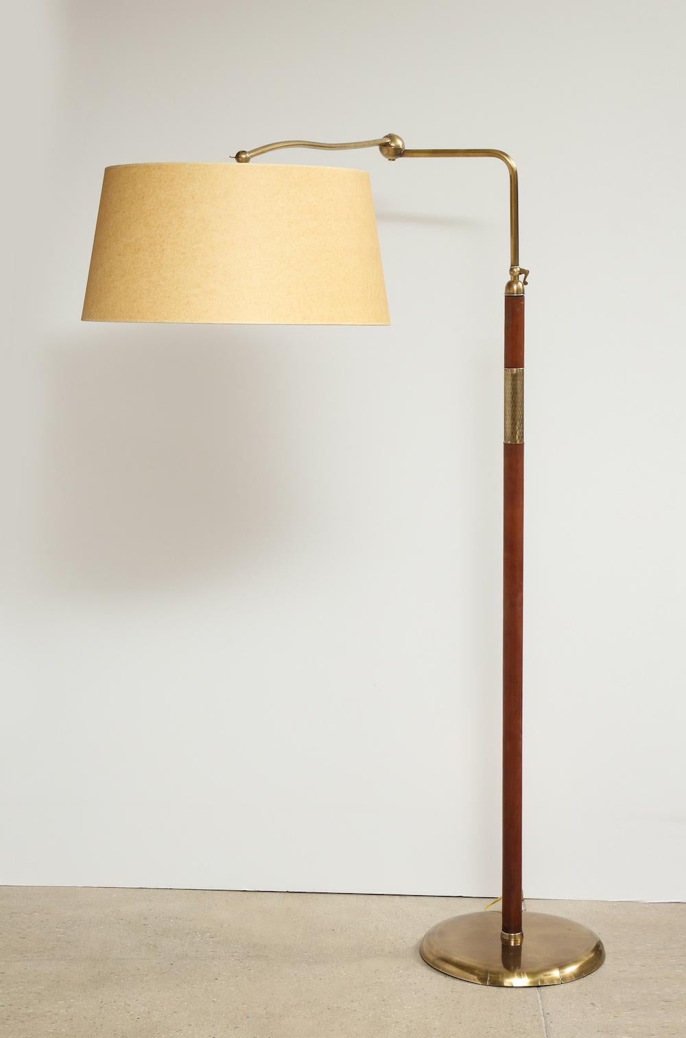No. 12246, floor lamp by Angelo Lelli for Arredoluce. Adjustable floor lamp with leather wrapped standard that adjusts up or down. Top arm pivots around and also extends. An early experimental model with a fantastic knuckle mechanism. Signed on
