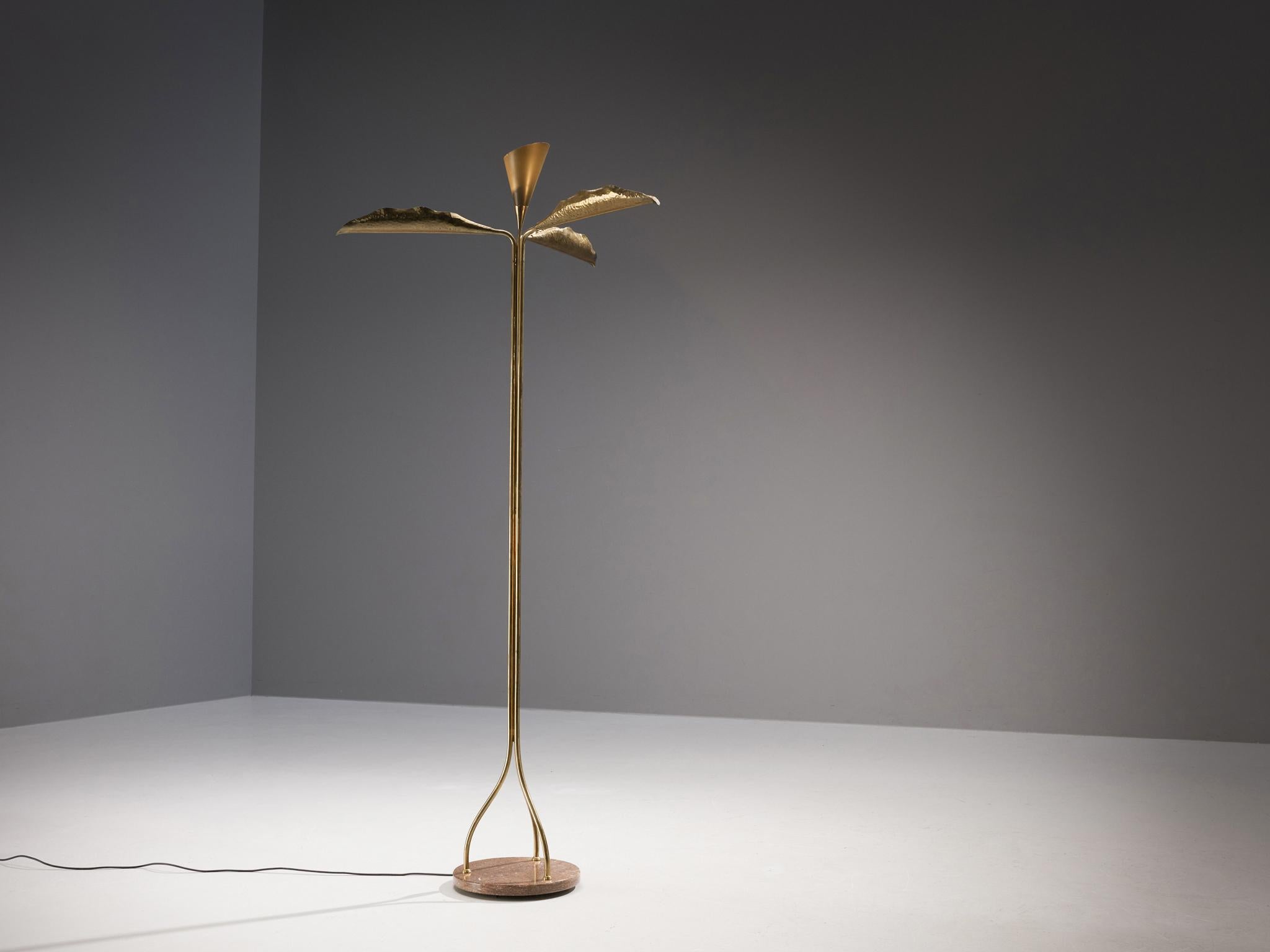 Angelo Lelii for Arredoluce, floor lamp, marble, brass, aluminum, Italy, circa 1951.

This rare floor lamp by Angelo Lelii presents an organic composition consisting of three leaves in hammered brass that open towards the ceiling and surround the