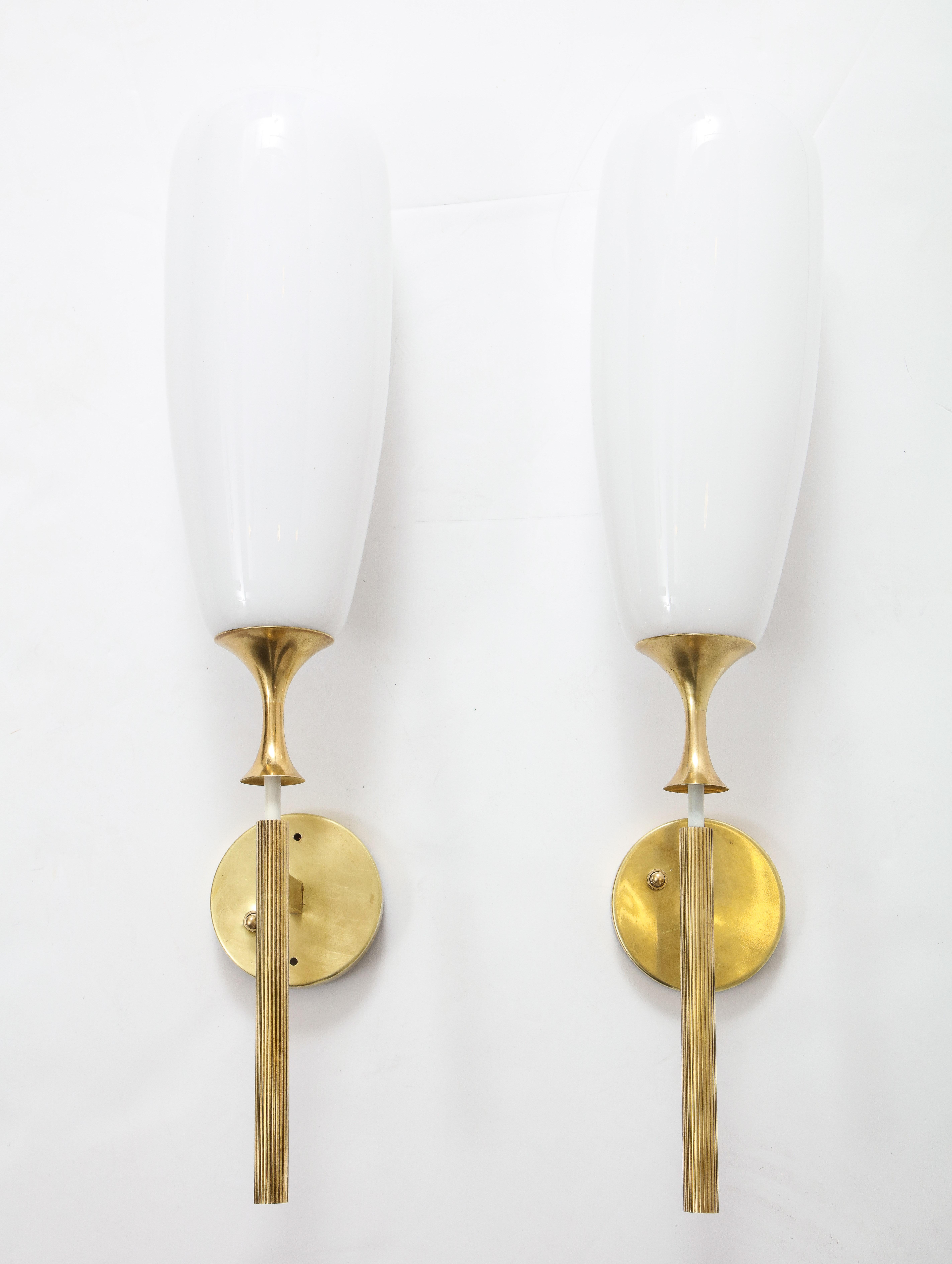 Stunning pair of large 1950s Angelo Lelii designed for Arredoluce brass and glass wall sconces, newly rewired and lightly refinished with beautiful patina to the brass.