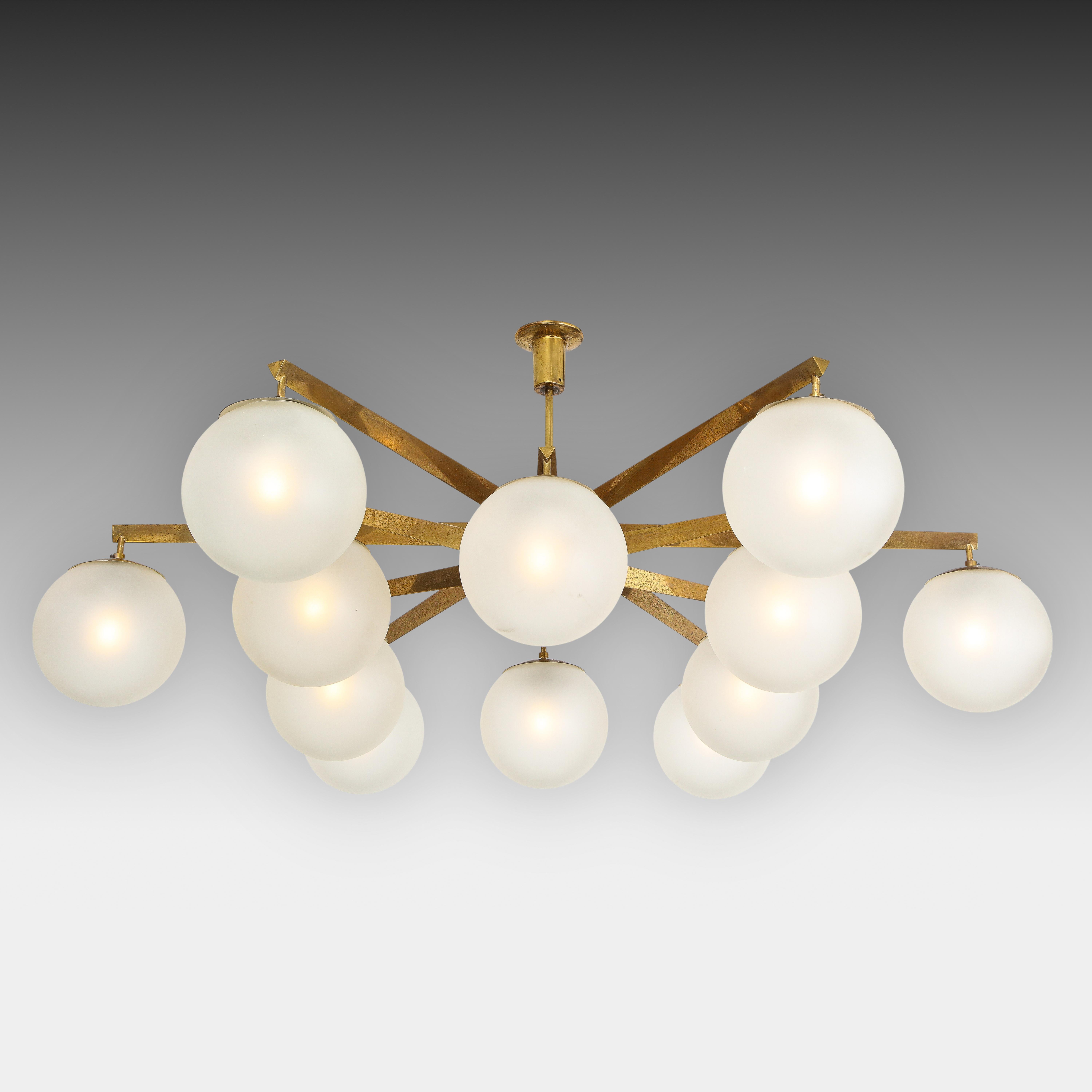 Angelo Lelli for Arredoluce rare spectacular original 'Stella a 12' chandelier or ceiling light with twelve acid-etched glass globe shades suspended from brass structure in a starburst shape and mount, Italy, circa 1959. Unlike most examples of this