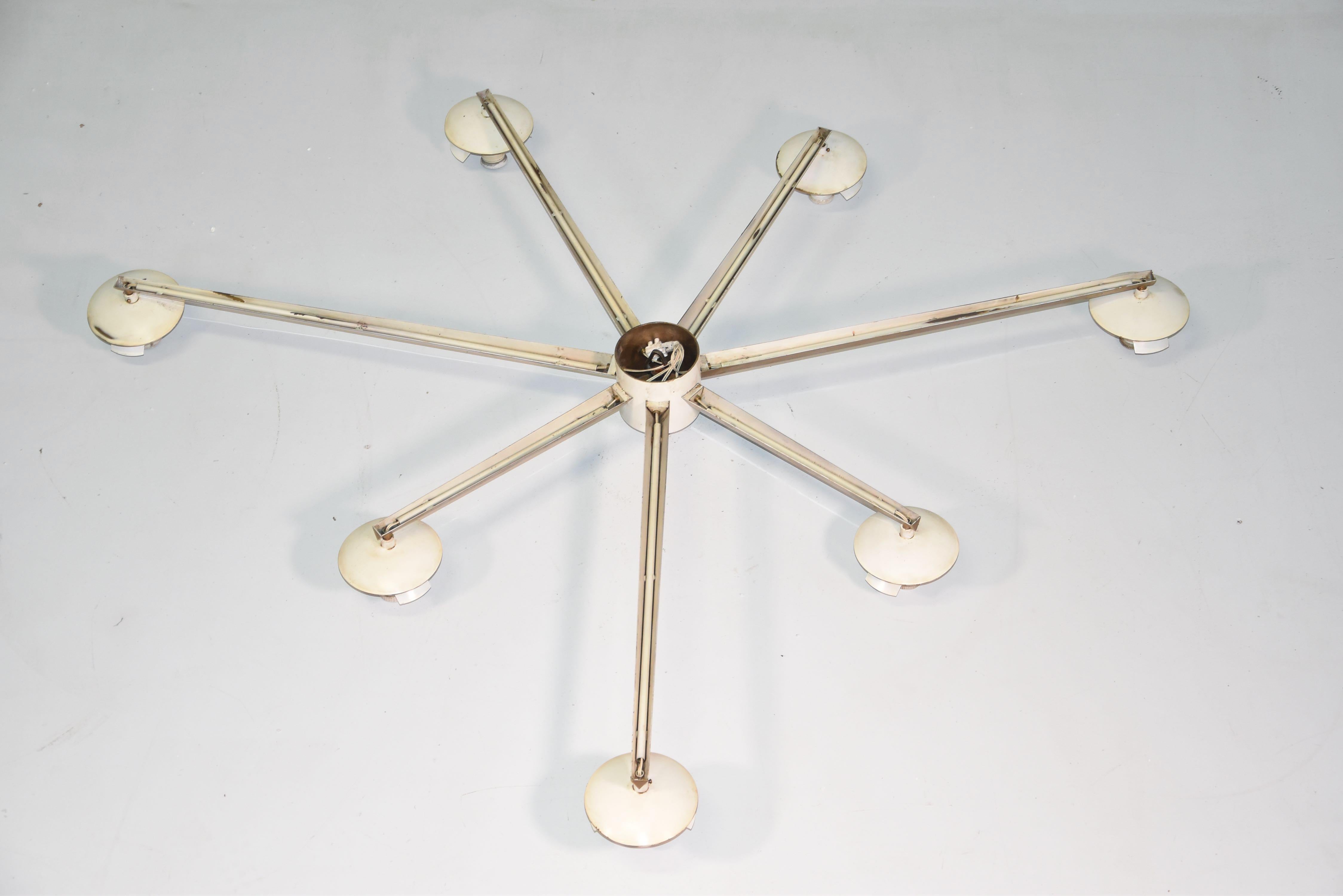 Angelo Lelli for Arredoluce rare original Stella flush mount ceiling light or chandelier with with seven acid-etched glass globe shades suspended from rich patinated brass structure and mount. With original label.
Literature: Arredoluce Catalogue