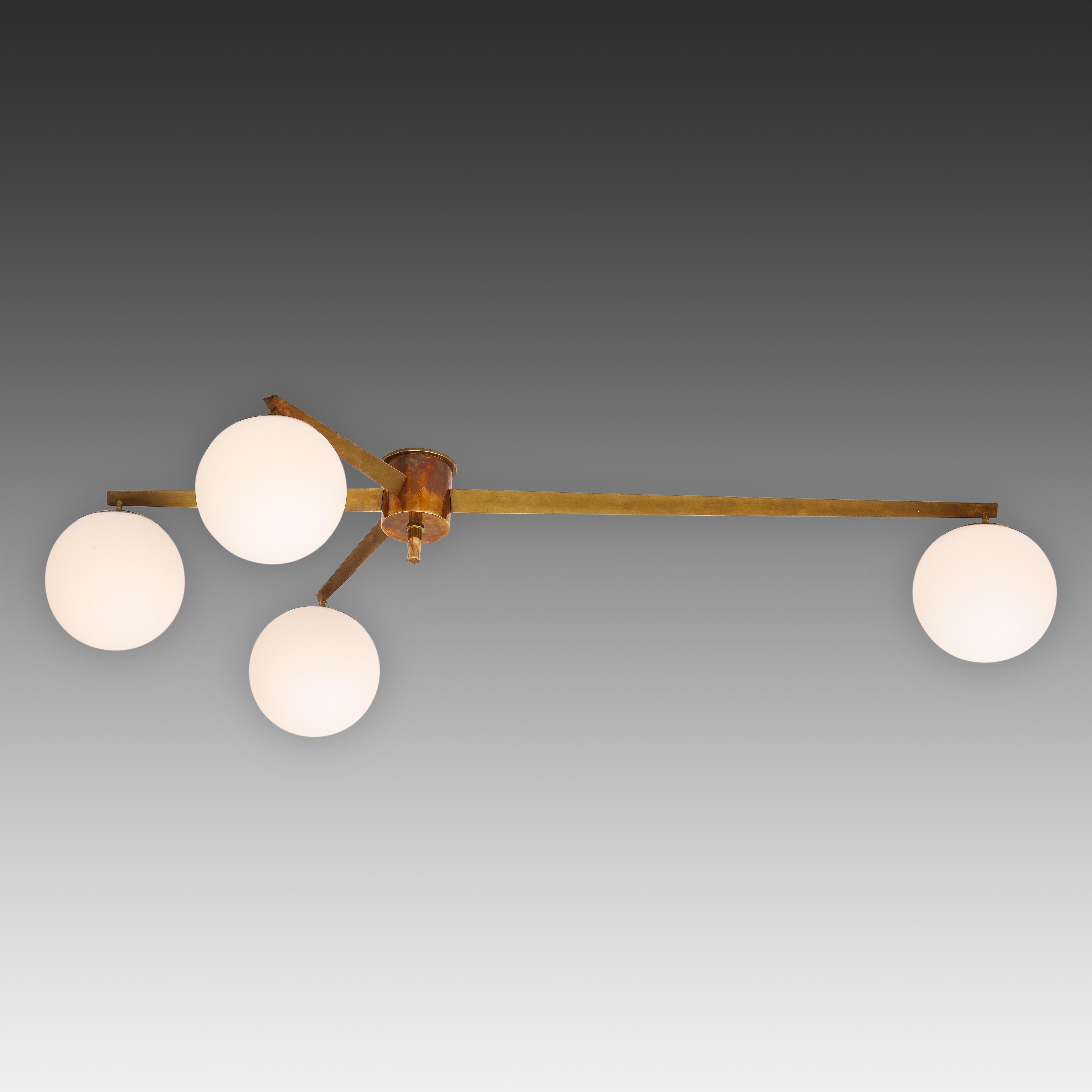 Angelo Lelli for Arredoluce original striking Stella 4arm flush mount ceiling light or chandelier with four opaline glass globe shades suspended from rich patinated brass structure and mount. This 4 lune model is more rare than the 6-arm and 3-arm