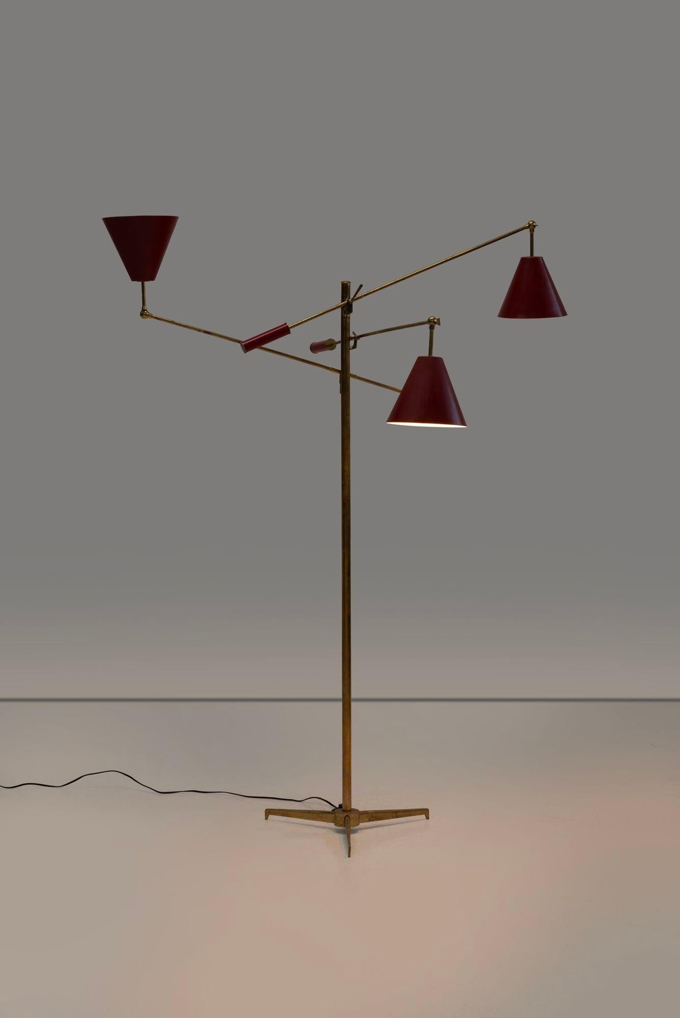 Angelo Lelii for Arredoluce Triennale Floor Lamp, model 12128 Italy, 1947
An original Brass frame on a tripod base with painted shades of enameled steel adjustable handles impressed the manufacturer's monogram to end cap on each pommel