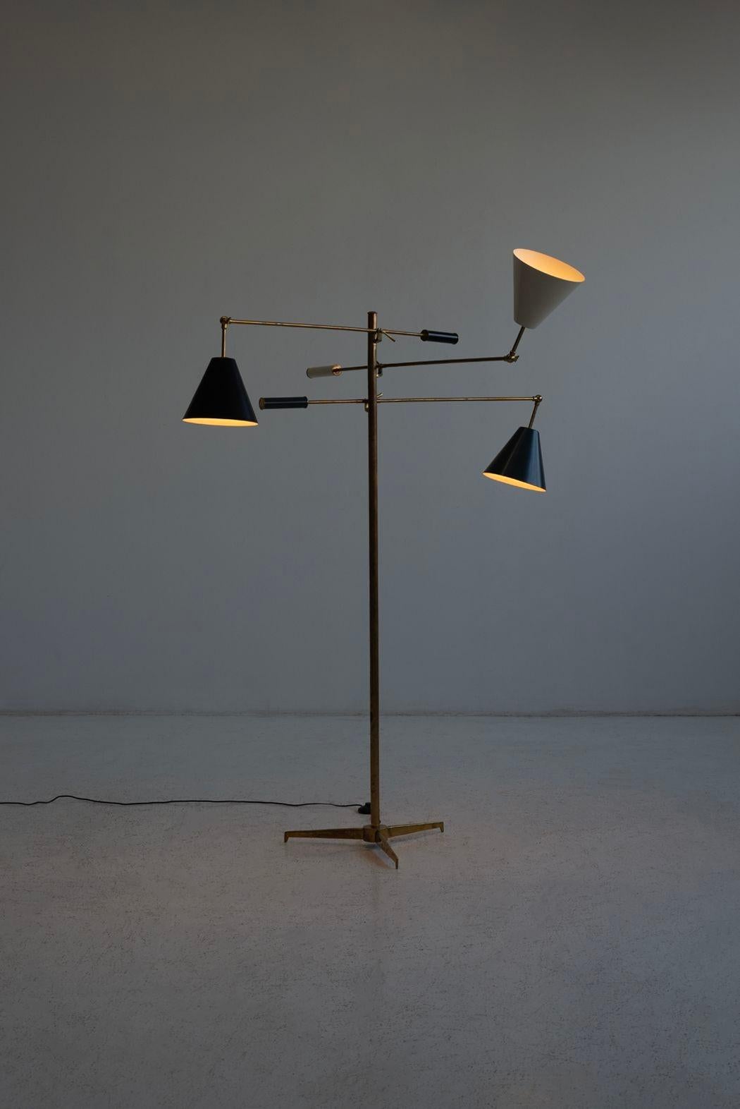 Angelo Lelii for Arredoluce Triennale Floor Lamp, model 12128 Italy, c. 1947
Brass adjustable arms with enamel aluminum shades and brass stem.
dimensions:
75 h × 43 w × 51 d in
Condition:
Patina on brass, minor scratches on shades, consistent with