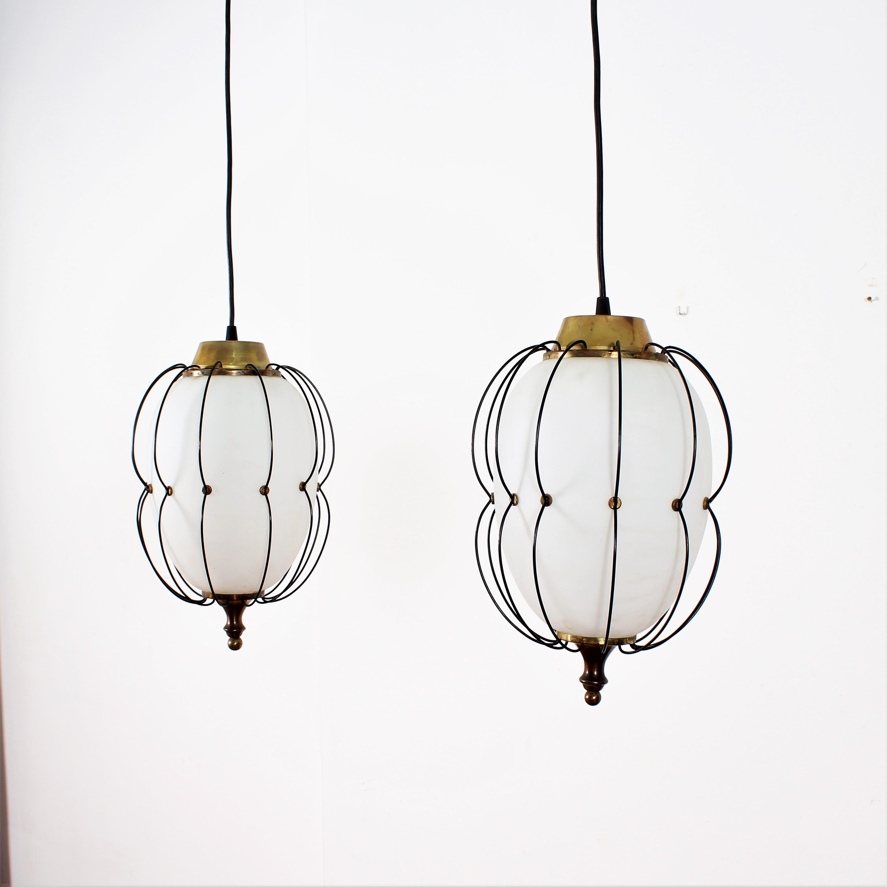 Midcentury brass and white opaline glass chandelier attributed to Angelo Lelii for Arredoluce Monza (Italy) in 1960s.
Wear consistent with age and use.
 