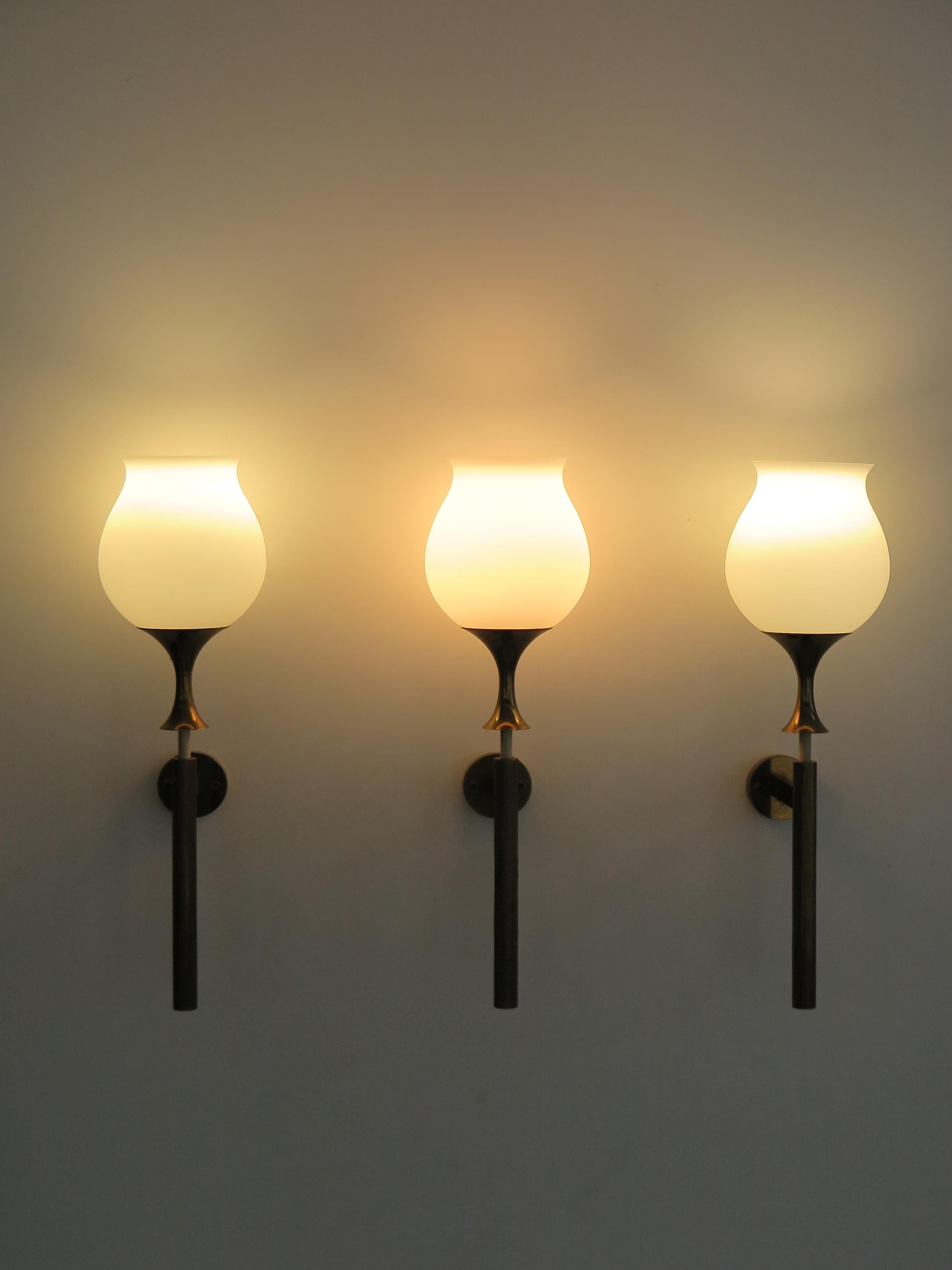 Italian midcentury modern design sconces wall lamps designed by Angelo Lelii and produced by Arredoluce Monza with white opaline glass diffusers and brass frame, production mark engraved on back, Italy 1950s 

Bibliography:
Pansera A., Padoan A.,