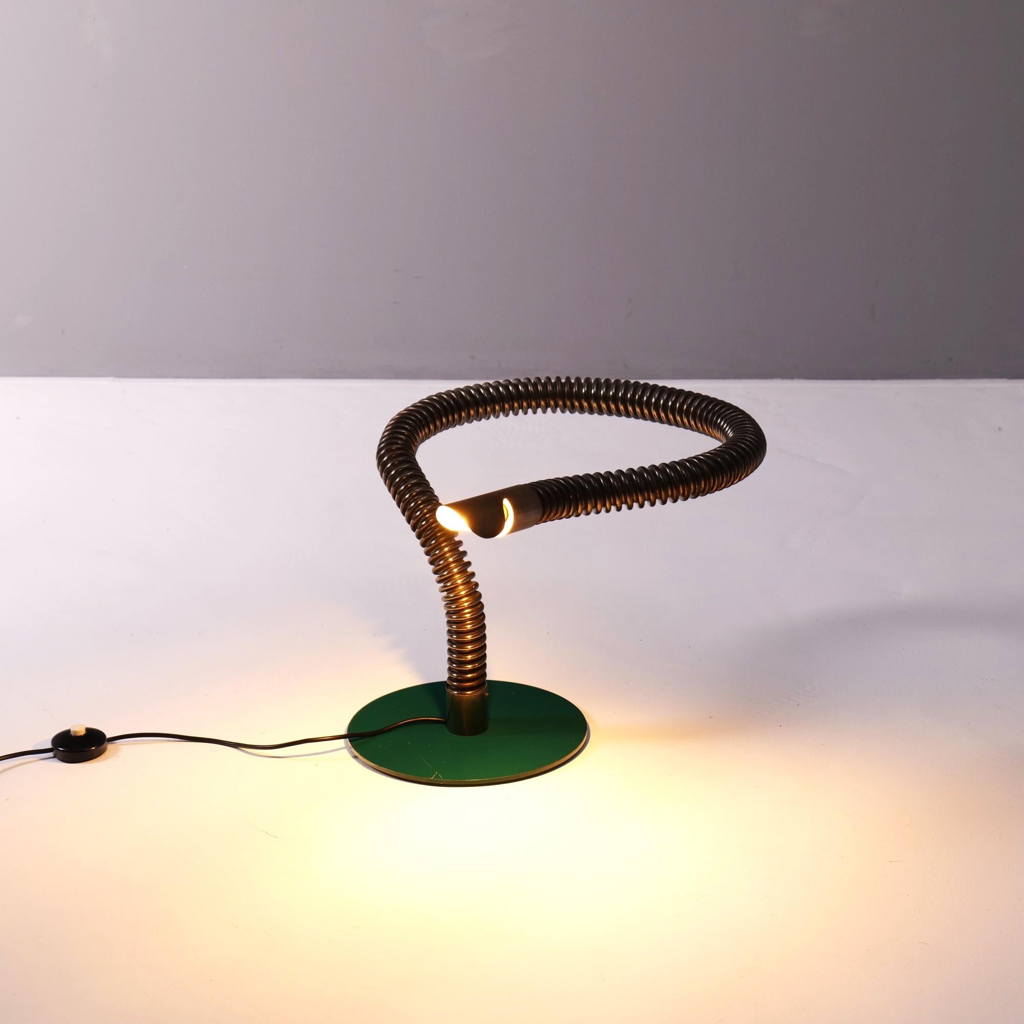 Sculptural, early postmodern table lamp by Angelo Lelii for Arredoluce.
The lamp originally came from an apartment in Paris, furnished by the famous interior designer Alberto Pinto.
Flexible tube made of steel, but firmly attached in this form to a
