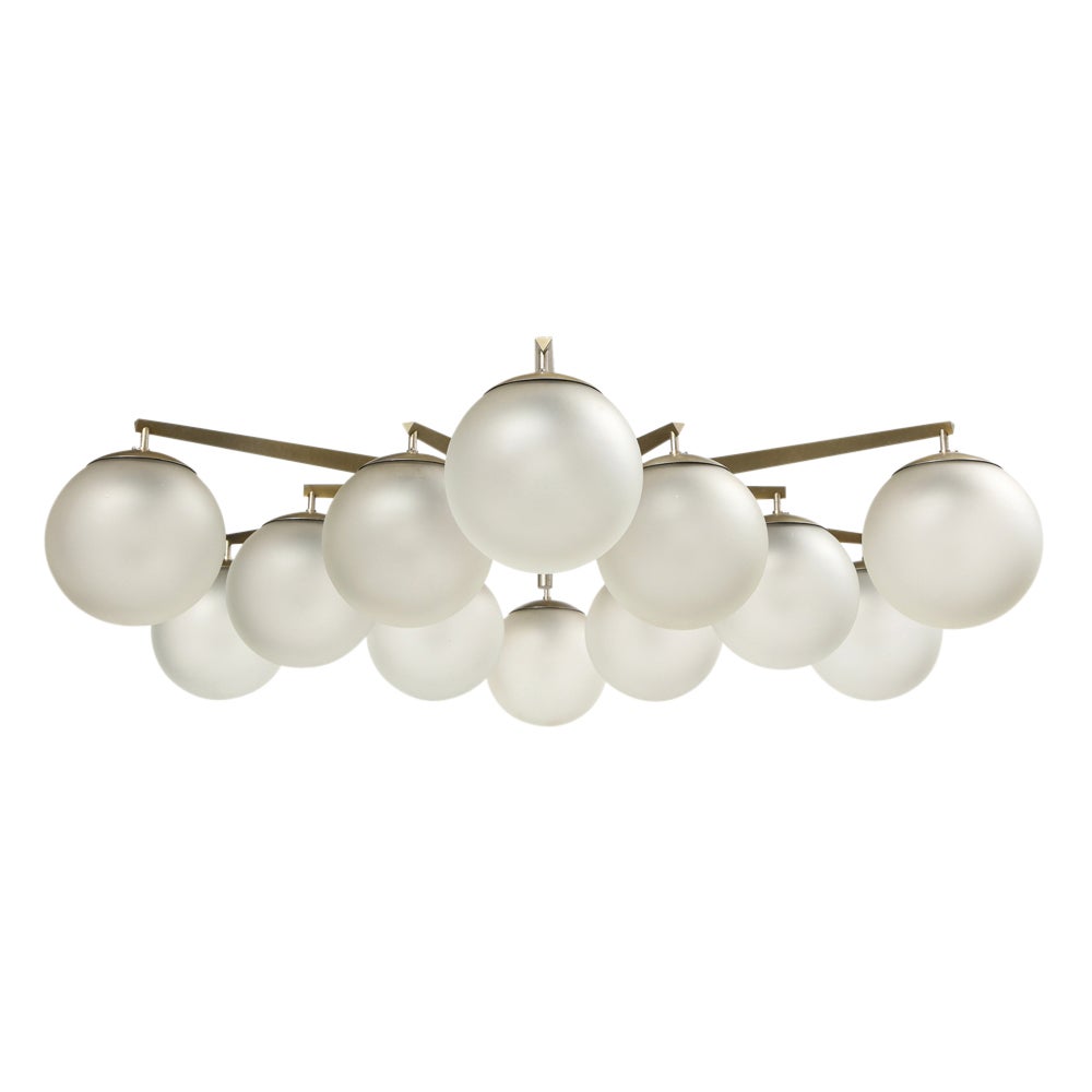 Angelo Lelii Stella chandelier, Arredoluce, Nickel Plated Brass, Glass, Signed. Impressive large scale starburst ceiling light with 12 arms and the original frosted globe shades. Our lighting restorer updated all 12 sockets and replaced the wiring