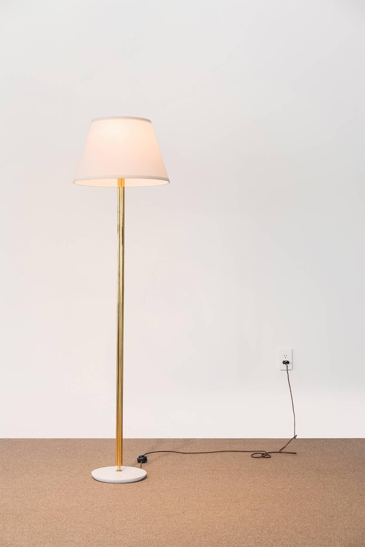 A floor lamp attributed to Italian designer Angelo Lelii for Arredoluce, Italy. Brass rod, marble base. 

 In the past, the designer's name has been misspelled as Angello Lelli or Angelo Lelli.

Angelo Lelii is one of many famous designers working