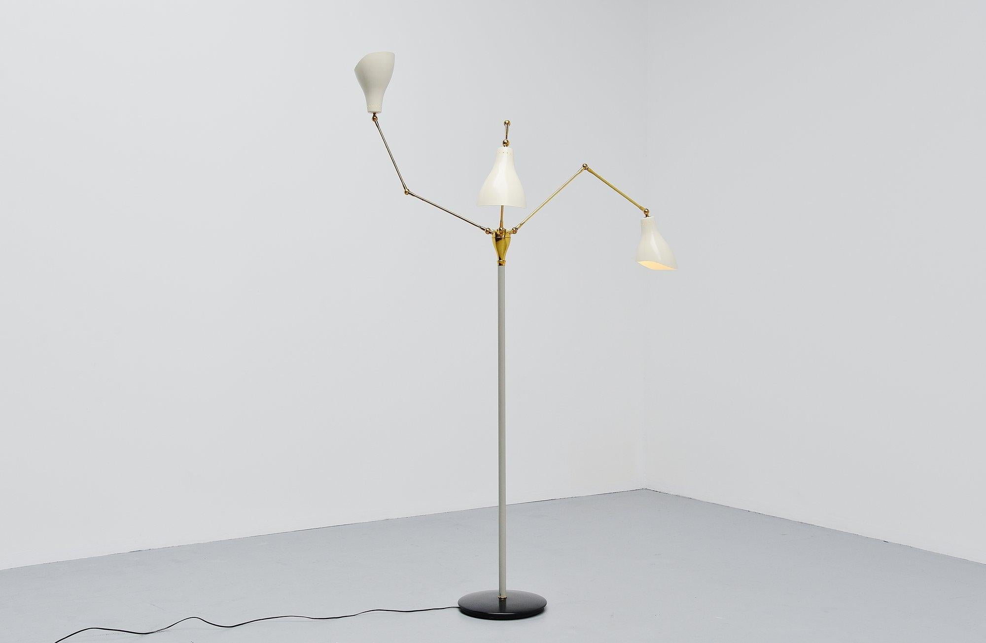 Fantastic three-armed adjustable standard lamp designed by Angelo-Lelli and manufactured by Arredoluce, Monza, Italy, 1950.This fantastic adjustable floor lamp is super nice large shaped and has three fully adjustable arms. This superb quality lamp