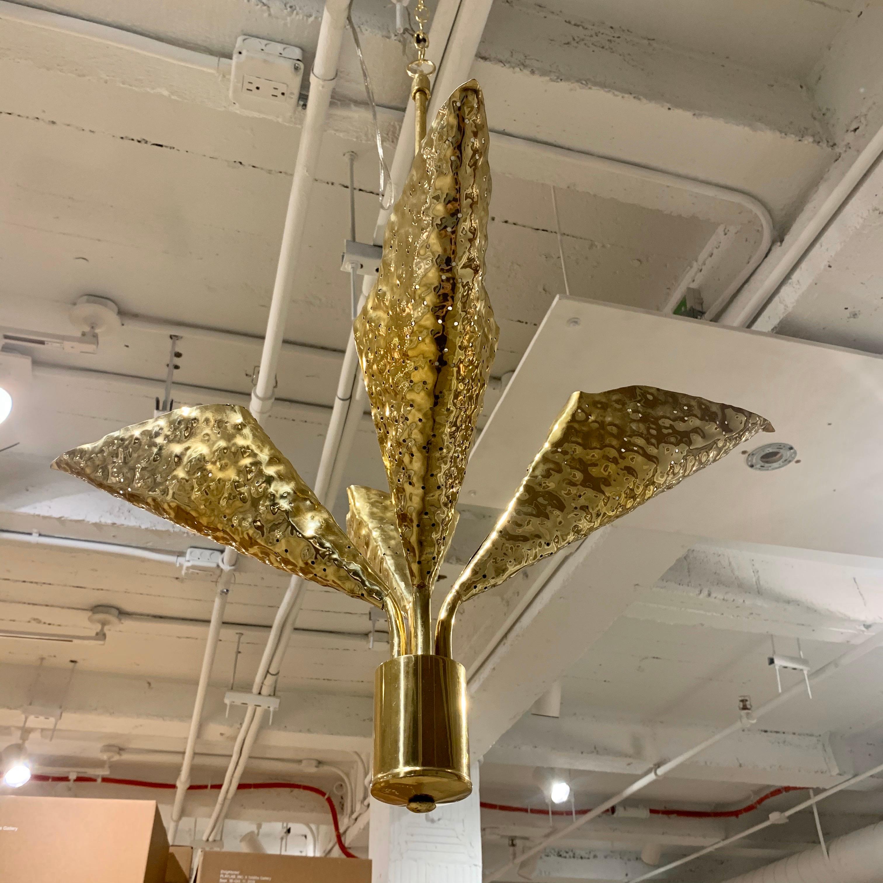 A rare 4 light golden brass pendant with perforated holes in the leave to emit light by Famed Italian architect, Angelo Lelli for Arredoluce. Newly Rewired . The ceiling pole can be shortened or lengthened as needed.