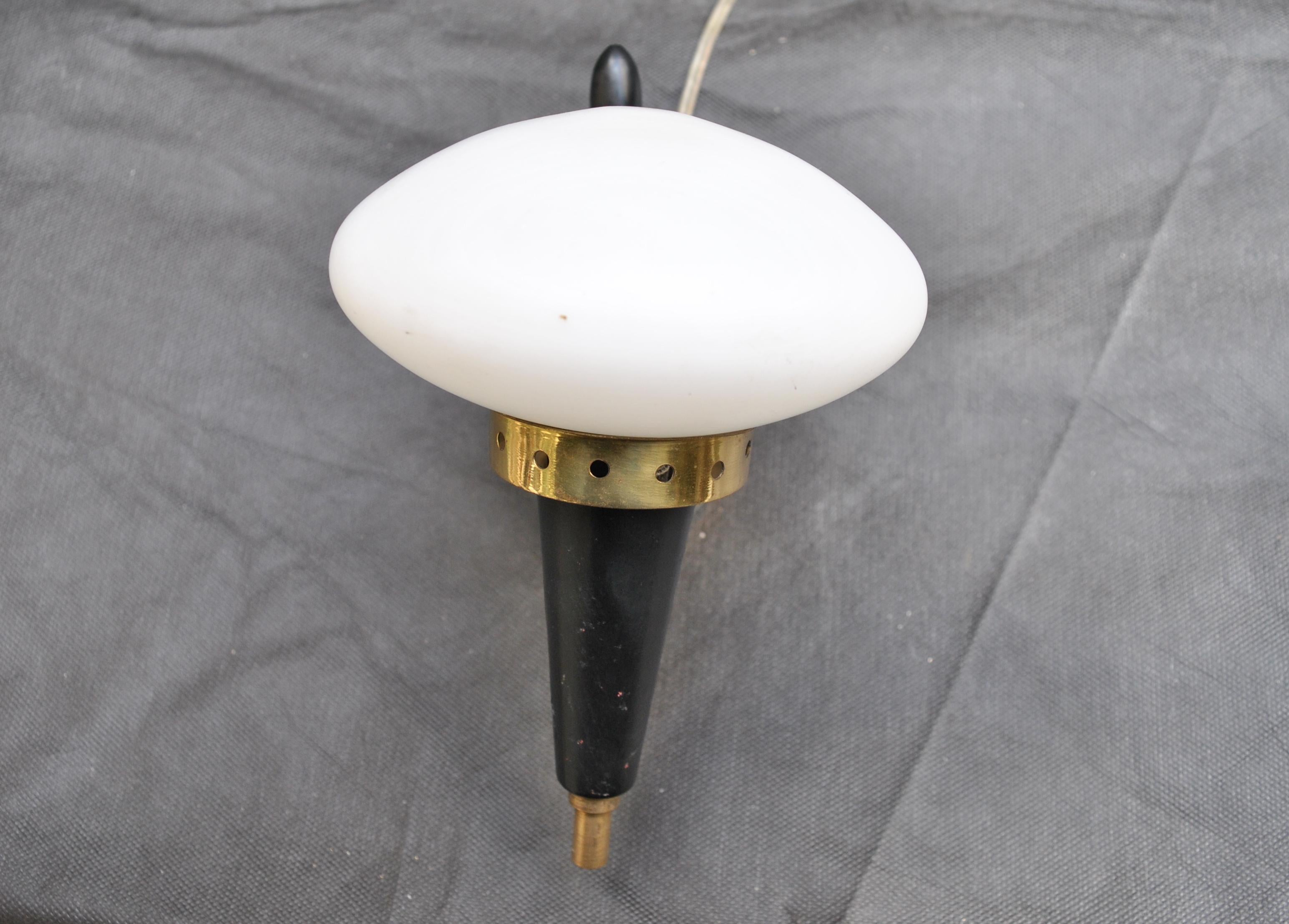 Italian wall light in brass, steel and opaline glass made after a design by Angelo Lelli in the 1950s.