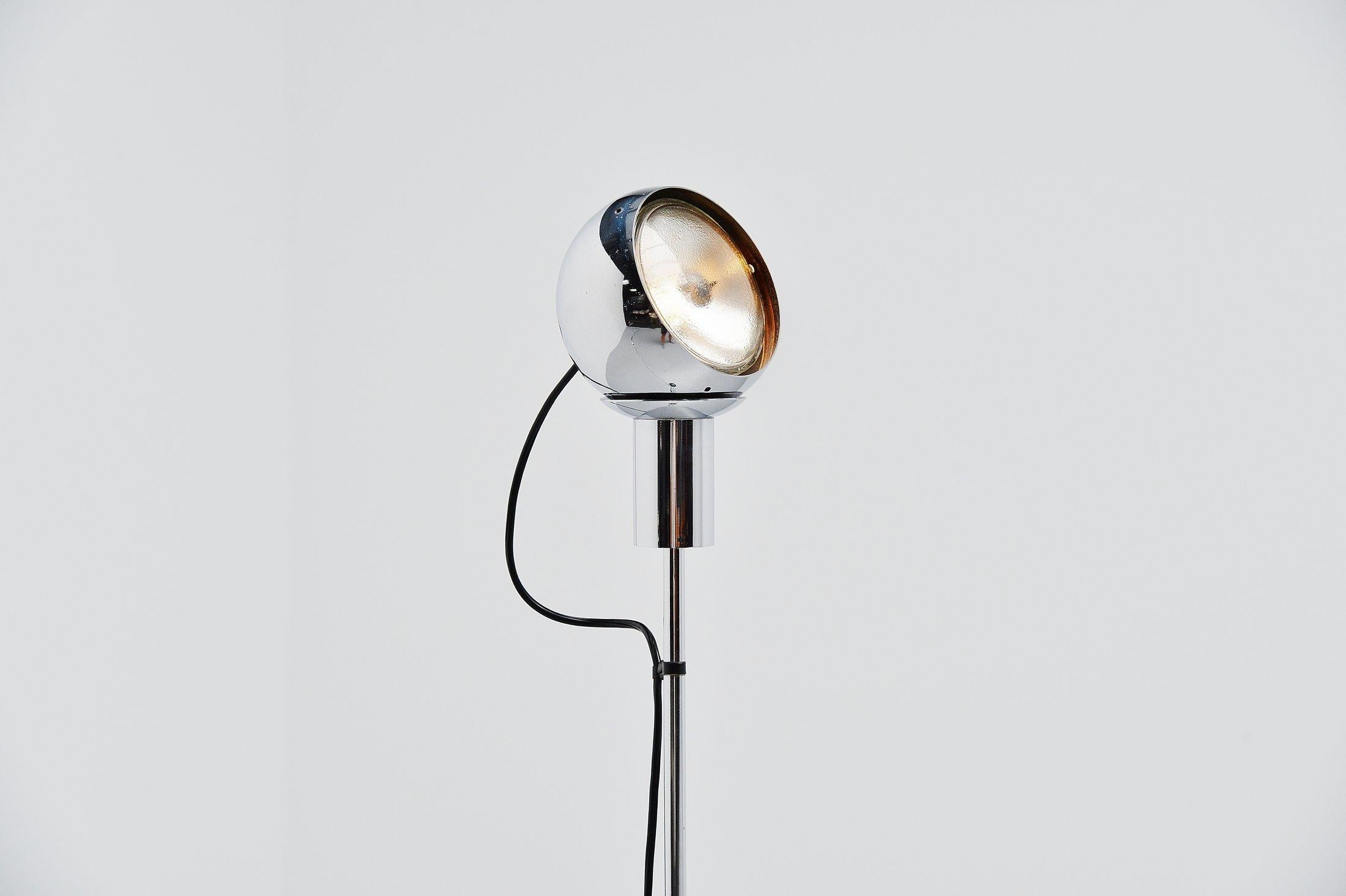 Very nice Minimalist floor lamp model 14002 designed by Angelo Lelli and manufactured by Arredoluce, Italy, 1966. The lamp has a metal base with incorporated transformer and on/off switch. Stem in magnetized and chrome-plated steel, adjustable