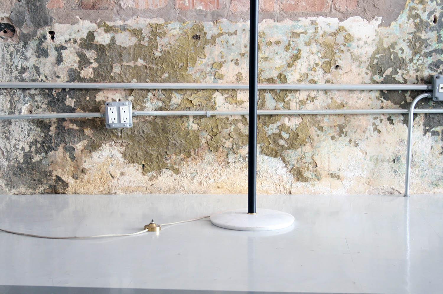 Torchiere floor lamp designed for Arredoluce, marble base with brass floor switch.