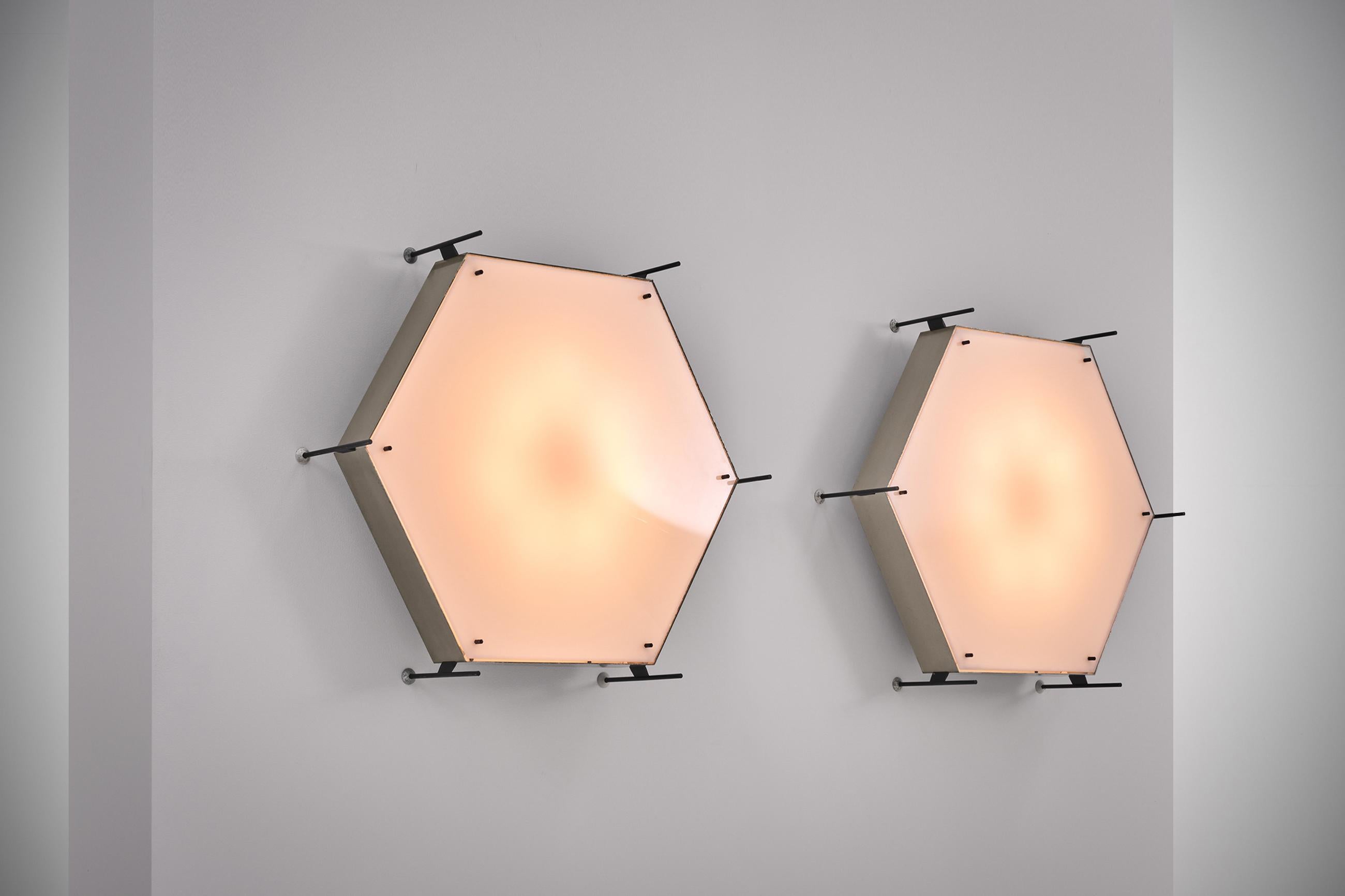 Rare and impressive pair of model no. 12712 lamps by Angelo Lelli for Arredoluce, Italy circa 1958. Very well made lamps out nickel-plated brass, painted brass and an acrylic diffuser. The lamps make quite an impression due to it's size and radical