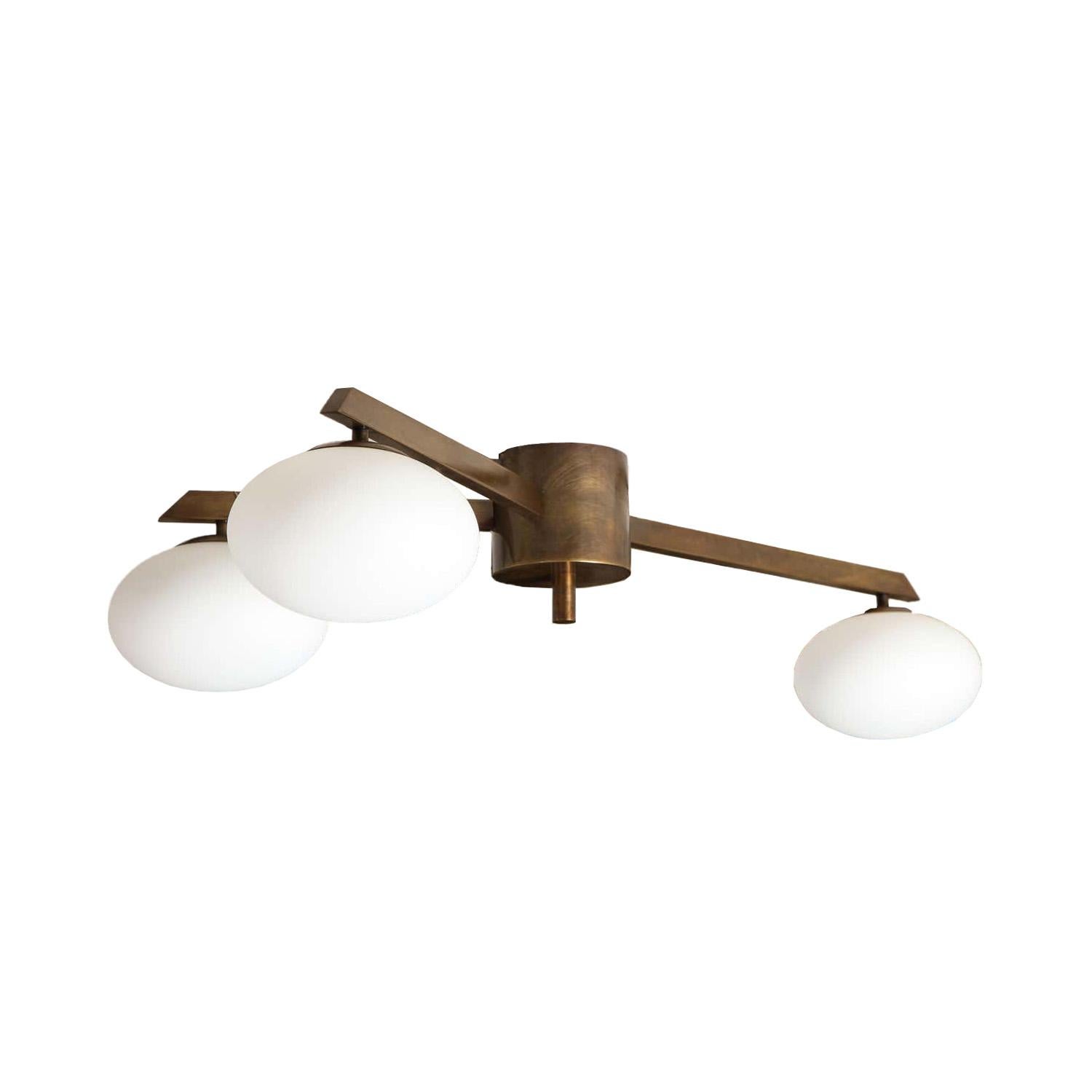 Murano opaline glass 3 globe flush mount light fixture with brass body. In the style of Angelo Lelli. By Venfield, Italy. 

Custom design, dimensions and finishes are available. Please inquire with Venfield for pricing and lead times.