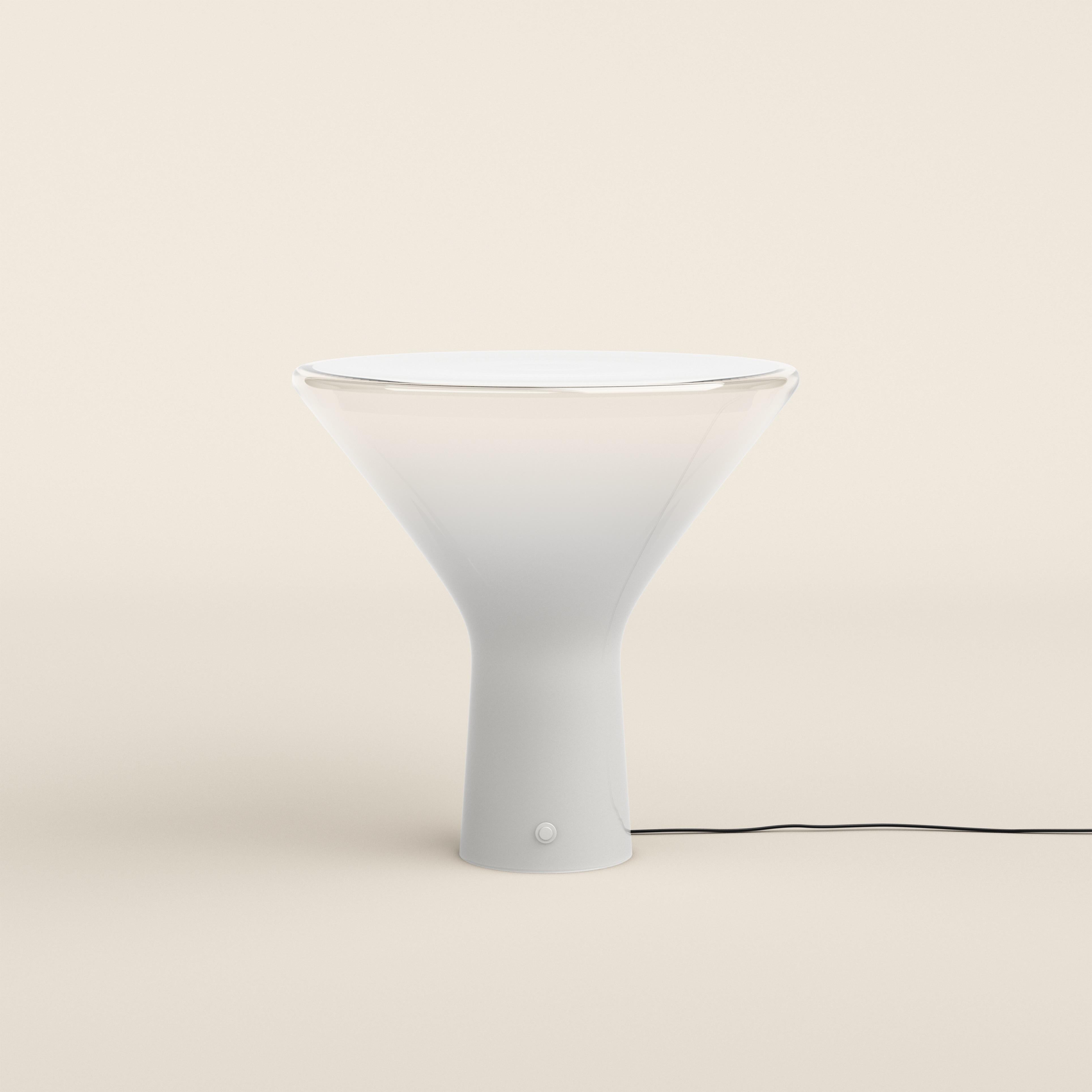 Angelo Mangiarotti Acceslsa Table Lamp for Karakter 

Designed in 1985 by Angelo Mangiarotti, a celebrated Italian architect, sculptor, and designer, the Accelsa lamp embodies a blend of timeless elegance and a contemporary appeal. Crafted from