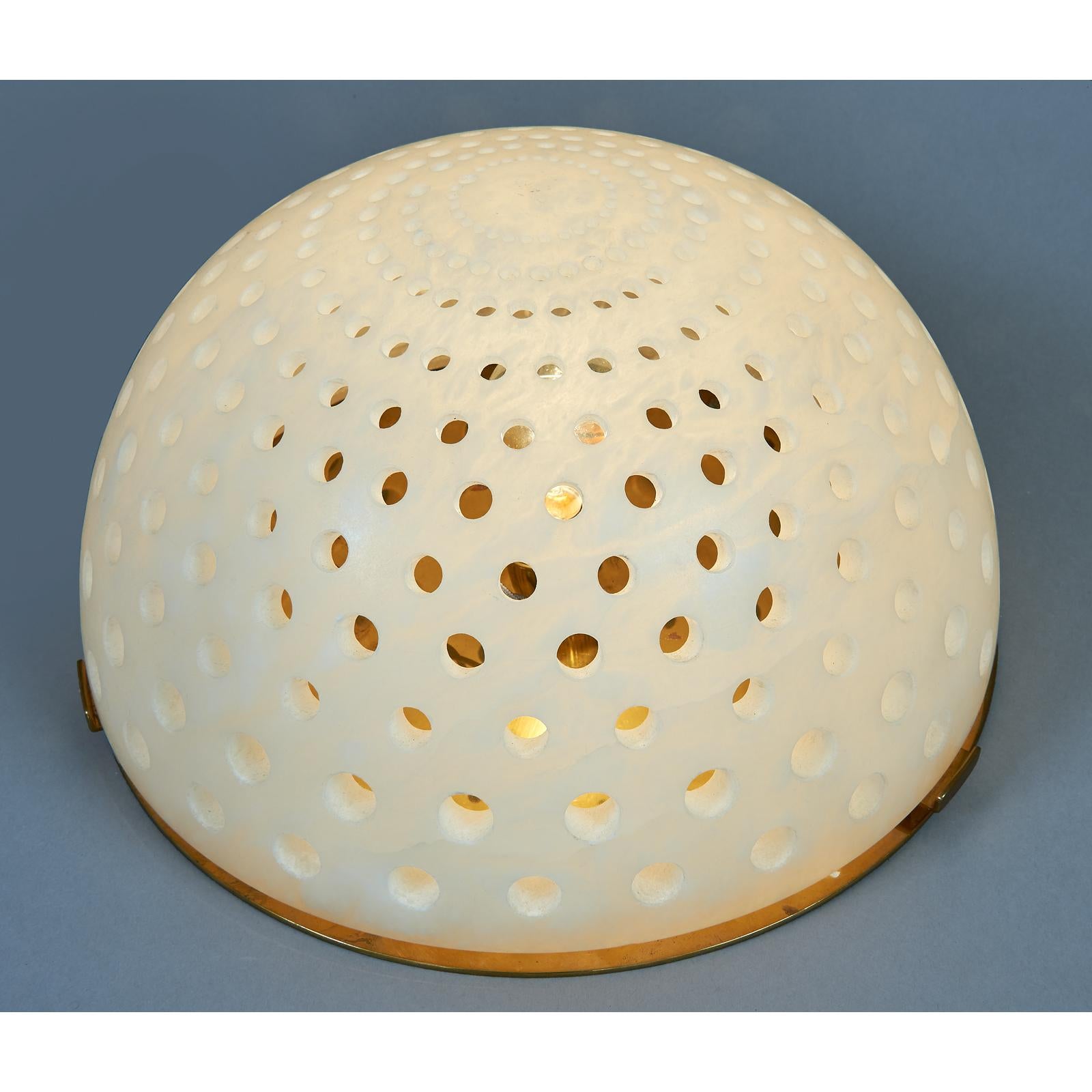Angelo Mangiarotti ( 1921-2012)
A wonderful alabaster table lamp, with a decorative rhythmic pattern of perforations throughout the dome which create a soft and tempered light.
Italy, circa 1980.
Dimensions: 16 diameter x 9 height.
 