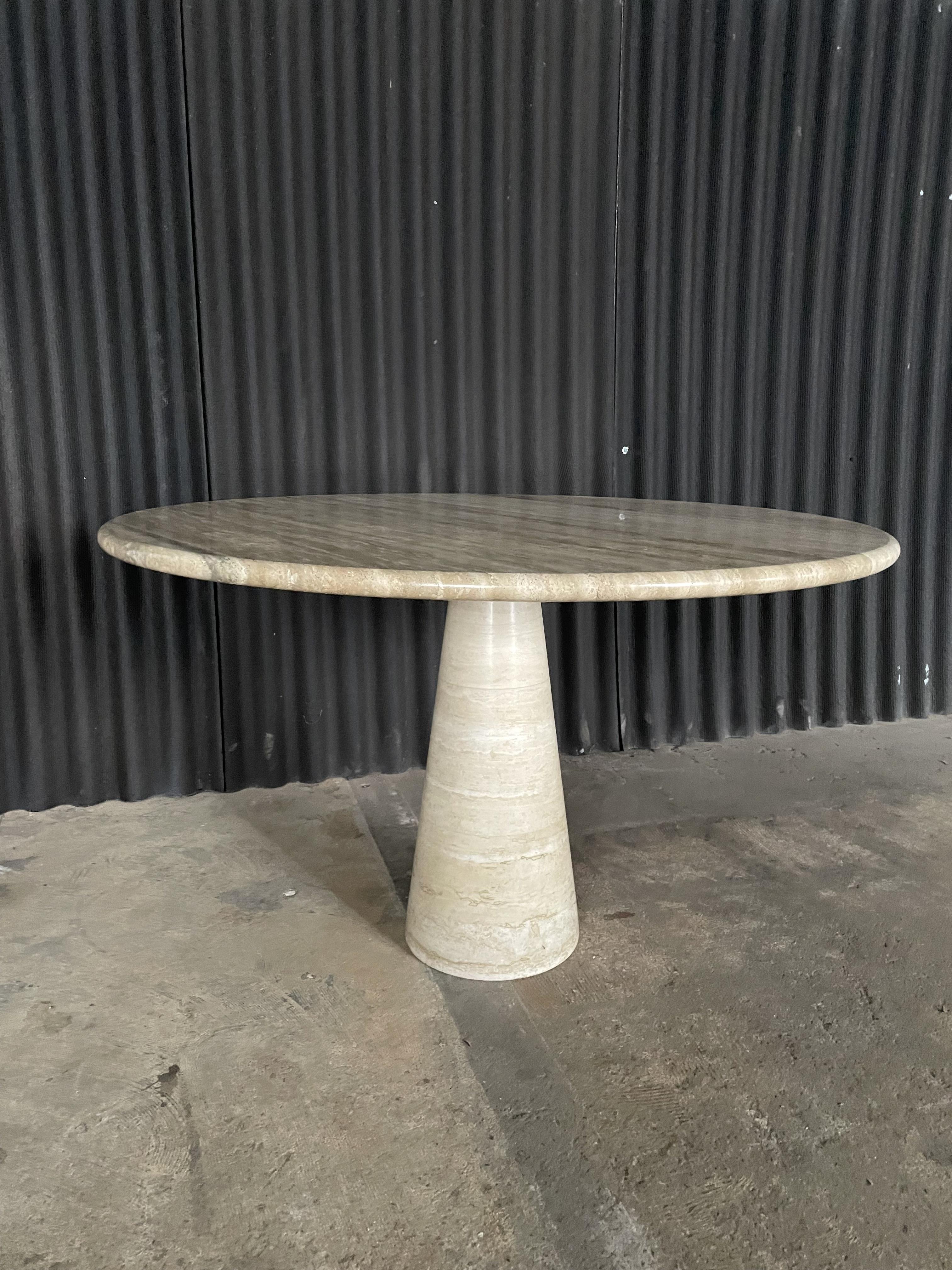 Gorgeous and classic round dining, or grand entrance, table in the manner of Angelo Mangiarotti. No Makers Mark. Italian, circa 70s. Conical table base is extremally attractive and in wonderful condition. Two areas 