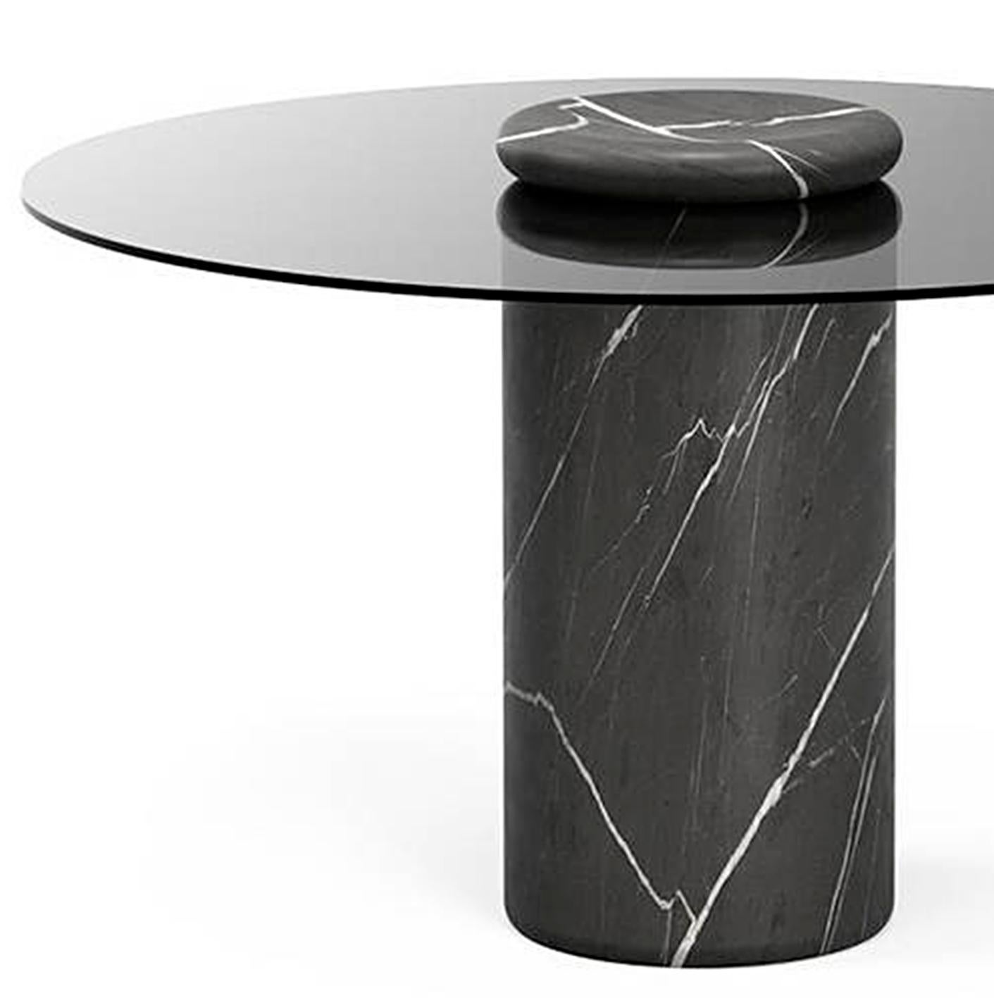 Table designed by Angelo Mangiarotti.

Castore is a glass and marble table by Italian architect, sculptor and designer Angelo Mangiarotti. Designed in 1975 for Sorgente dei Mobili, the distinct design is now presented by Karakter, available as a