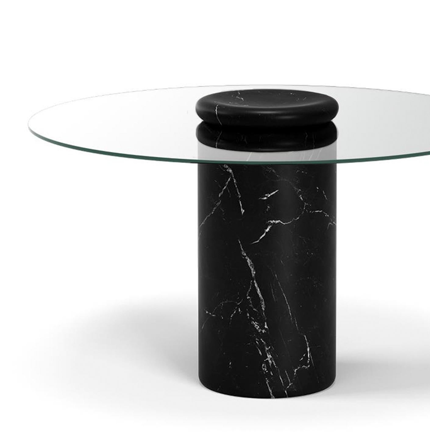 Table designed by Angelo Mangiarotti 

Castore is a glass and marble table by Italian architect, sculptor and designer Angelo Mangiarotti. Designed in 1975 for Sorgente dei Mobili, the distinct design is now presented by Karakter, available as a