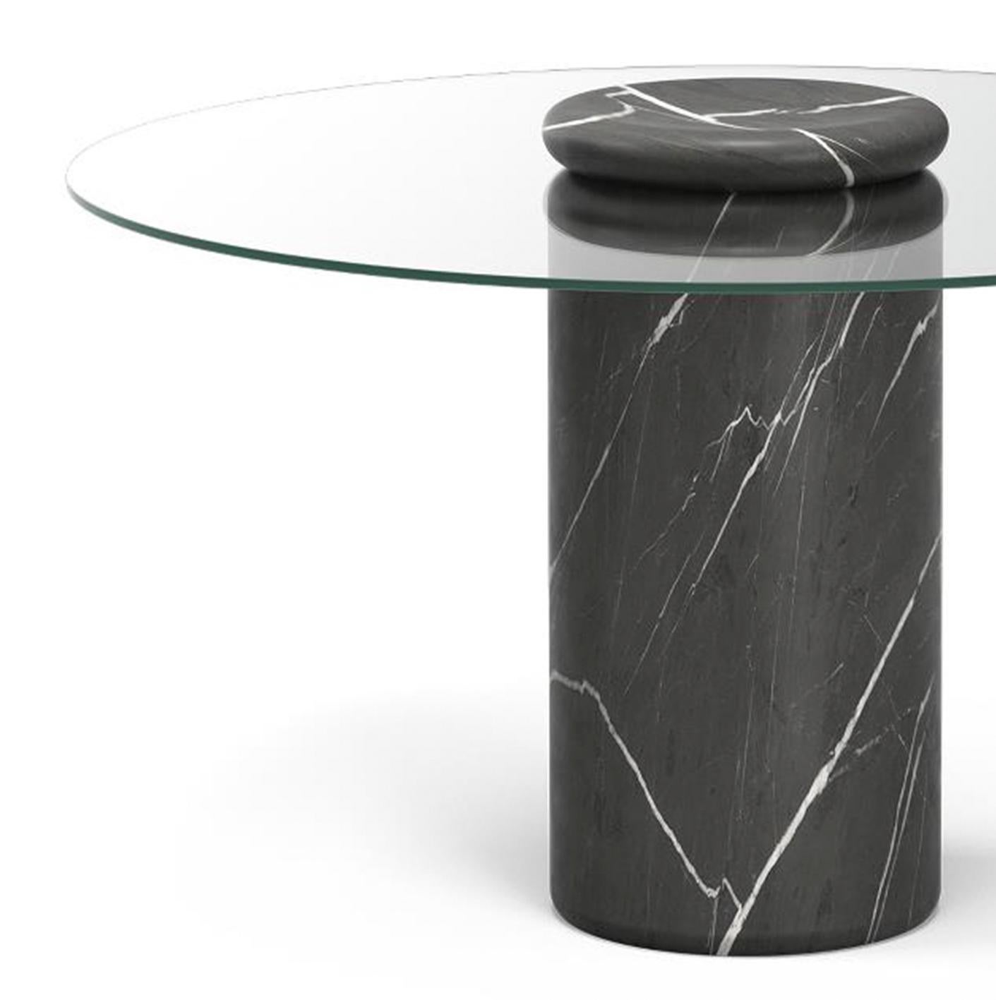 Table designed by Angelo Mangiarotti 

Castore is a glass and marble table by Italian architect, sculptor and designer Angelo Mangiarotti. Designed in 1975 for Sorgente dei Mobili, the distinct design is now presented by Karakter, available as a