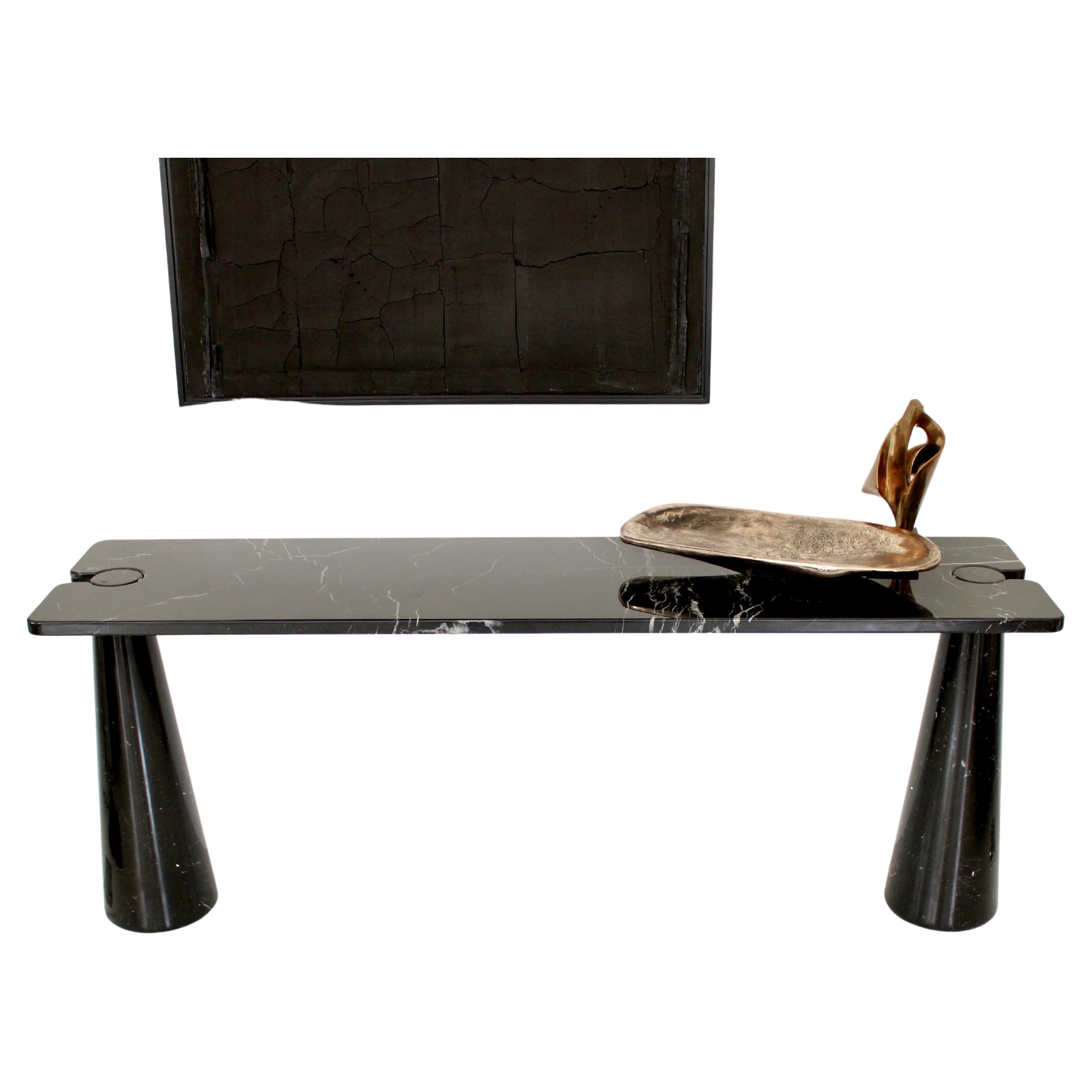 Angelo Mangiarotti vintage iconic Italian console Eros collection for Skipper model E 20.
The black or Nero Marquina marble is veined nicely.
The top sits on the conical legs in the iconic Mangiarotti finely designed architectural manner. No