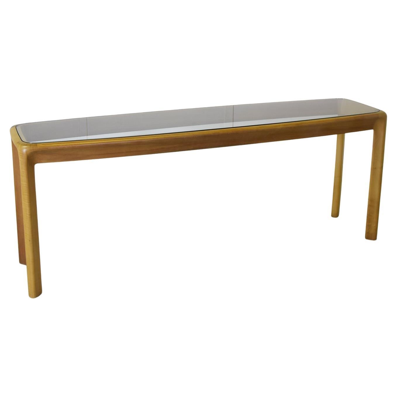 Beechwood console table with smoked glass top production La sorgente del Mobile series De Nos designer Angelo Mangiarotti Angelo Mangiarotti was a master of design, seamlessly blending elegance and functionality in every creation. With his