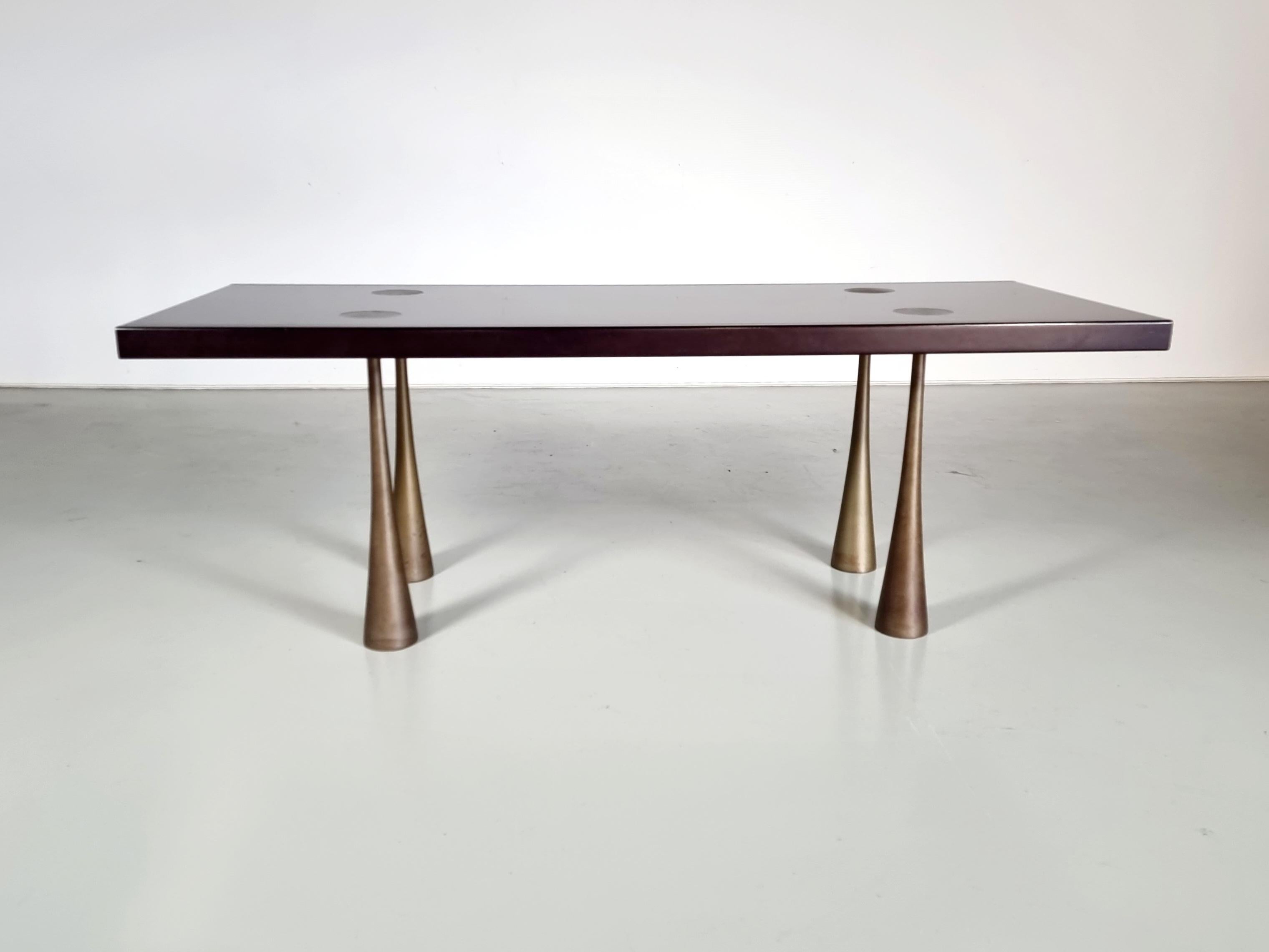 Rare original Angelo Mangiarotti dining table, for La Sorgente Dei Mobili, Italy, 1970s.

The table has four supporting legs, with an elephant's foot shape, so they spread out towards the bottom. They are entirely made of nickel-plated brass. The