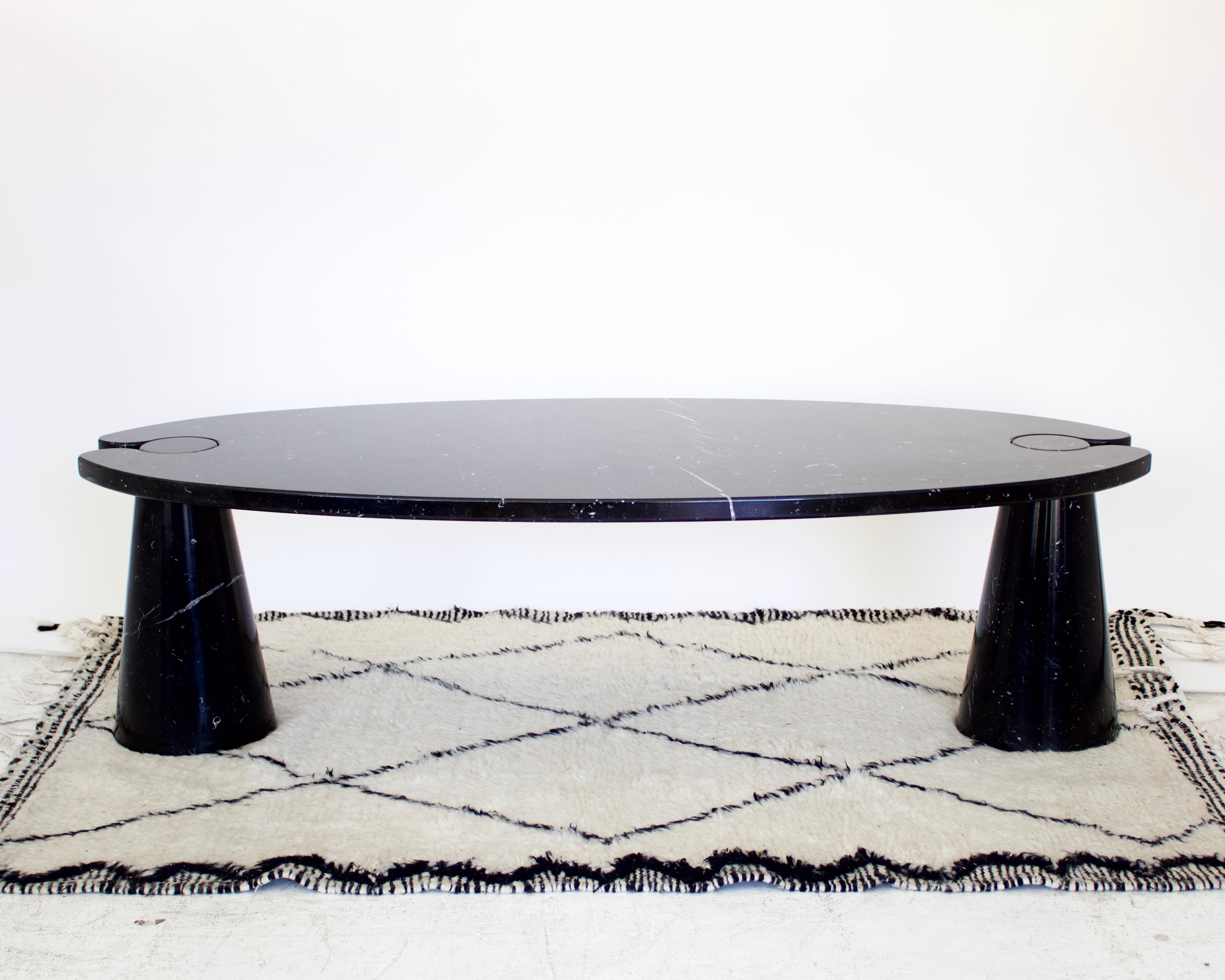 Angelo Mangiarotti Eros black Marquina marble coffee table. 
Oval shape, two pedestals supporting one oval top. Classic Mangiarotti and would lovely in any home, modern or transitional. 
The unique architectural aspects of Angelo Mangiarotti make