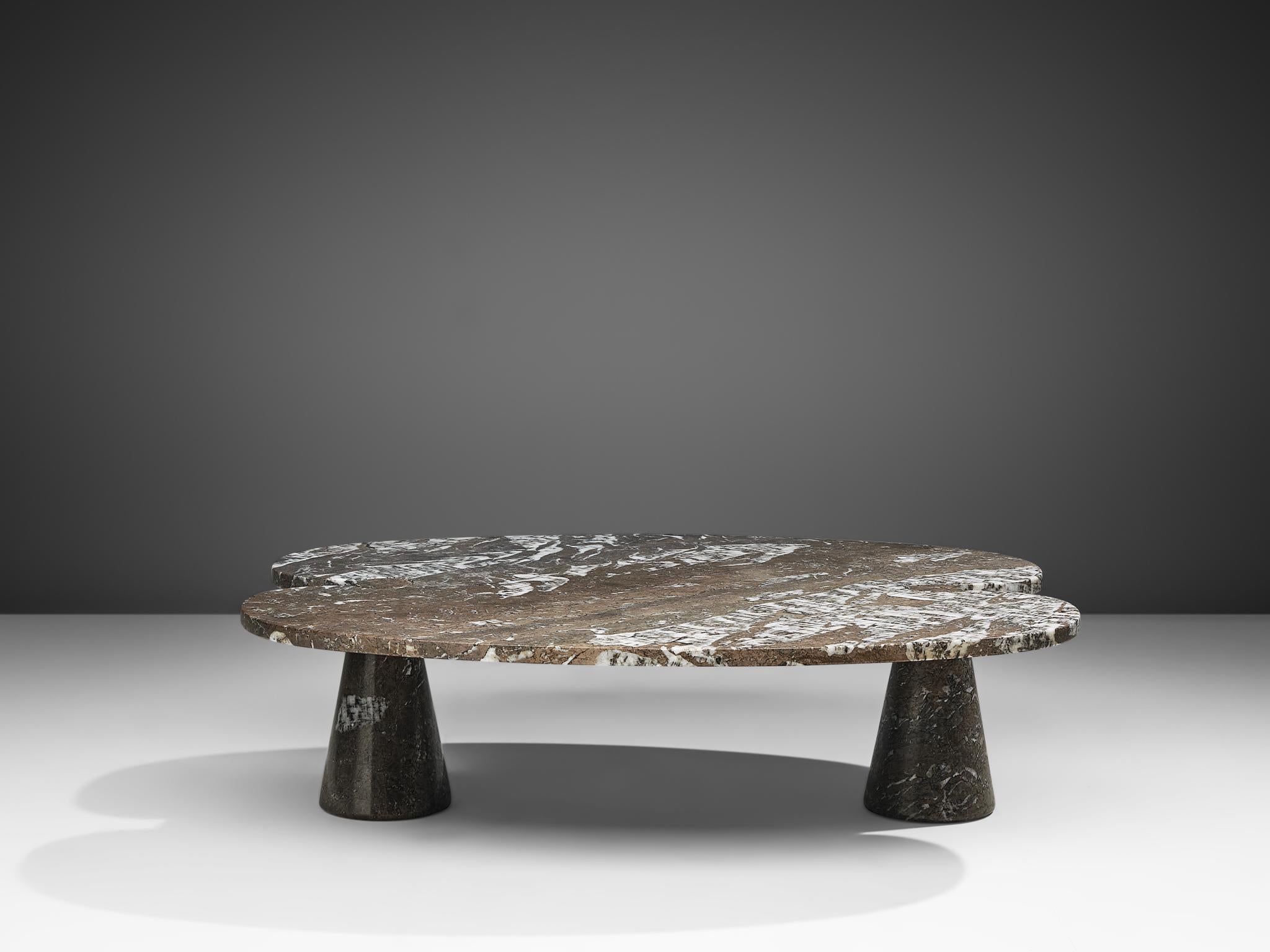 Angelo Mangiarotti for Skipper, 'Eros' coffee table, grey Mondragone marble, Italy, 1970s. 

This sculptural table by Angelo Mangiarotti is a skillful example of postmodern design. The bi-leaf like coffee table features no joints or clamps and is
