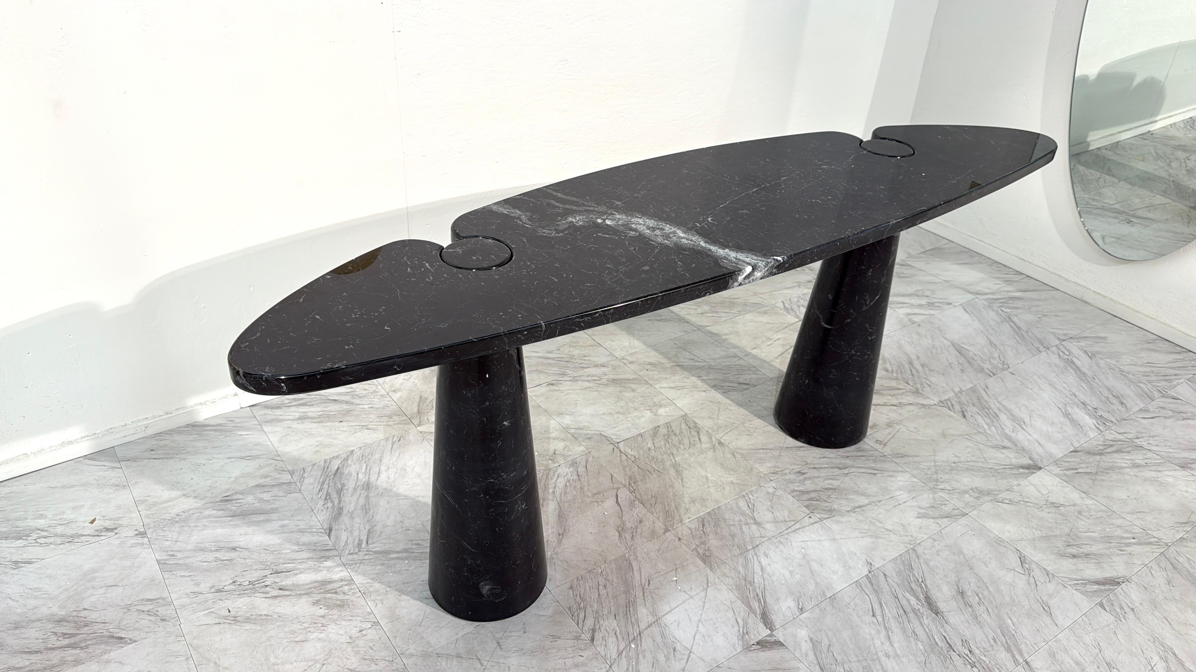 Exceptional “Eros” console table designed by Angelo Mangiarotti in the 1970s, executed in Black Marquina marble.

The Eros series is celebrated for its innovative structural concept, where the top and legs interlock through precisely cut circular