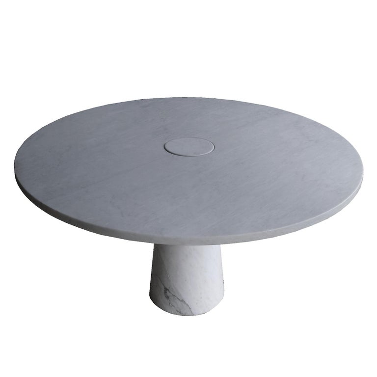 A light grey marble round table, the top pierced at the center and receiving the conical marble stem.
Produced by Skipper, Italy,
1970s.

Note
A very nice table, in very good condition, from the 