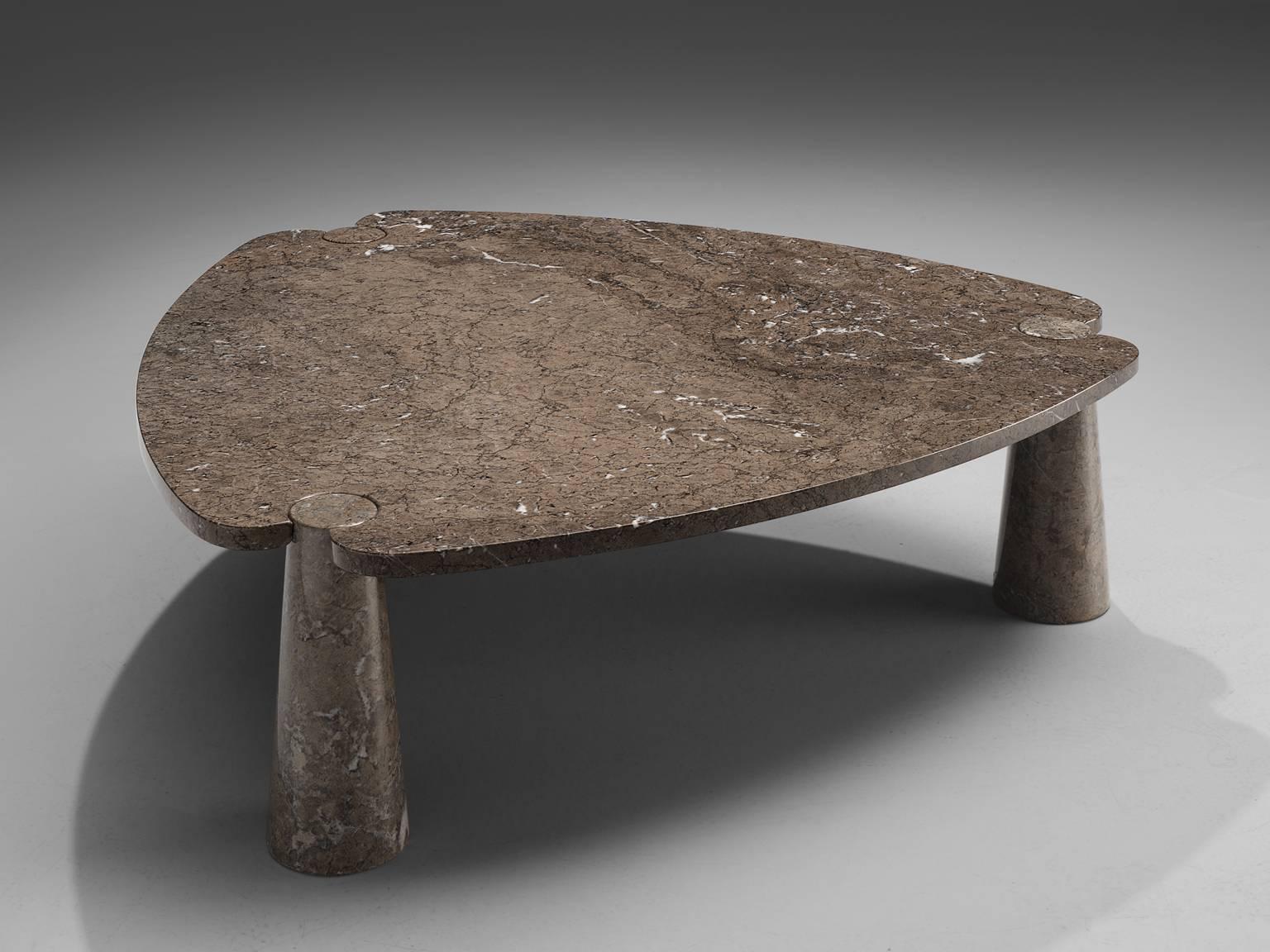 Angelo Mangiarotti, coffee table, marble, 1970s. 

This sculptural side table by Angelo Mangiarotti is a skillful example of postmodern design. The table is executed in grey marble featuring delicate white veins. The soft edged triangle table