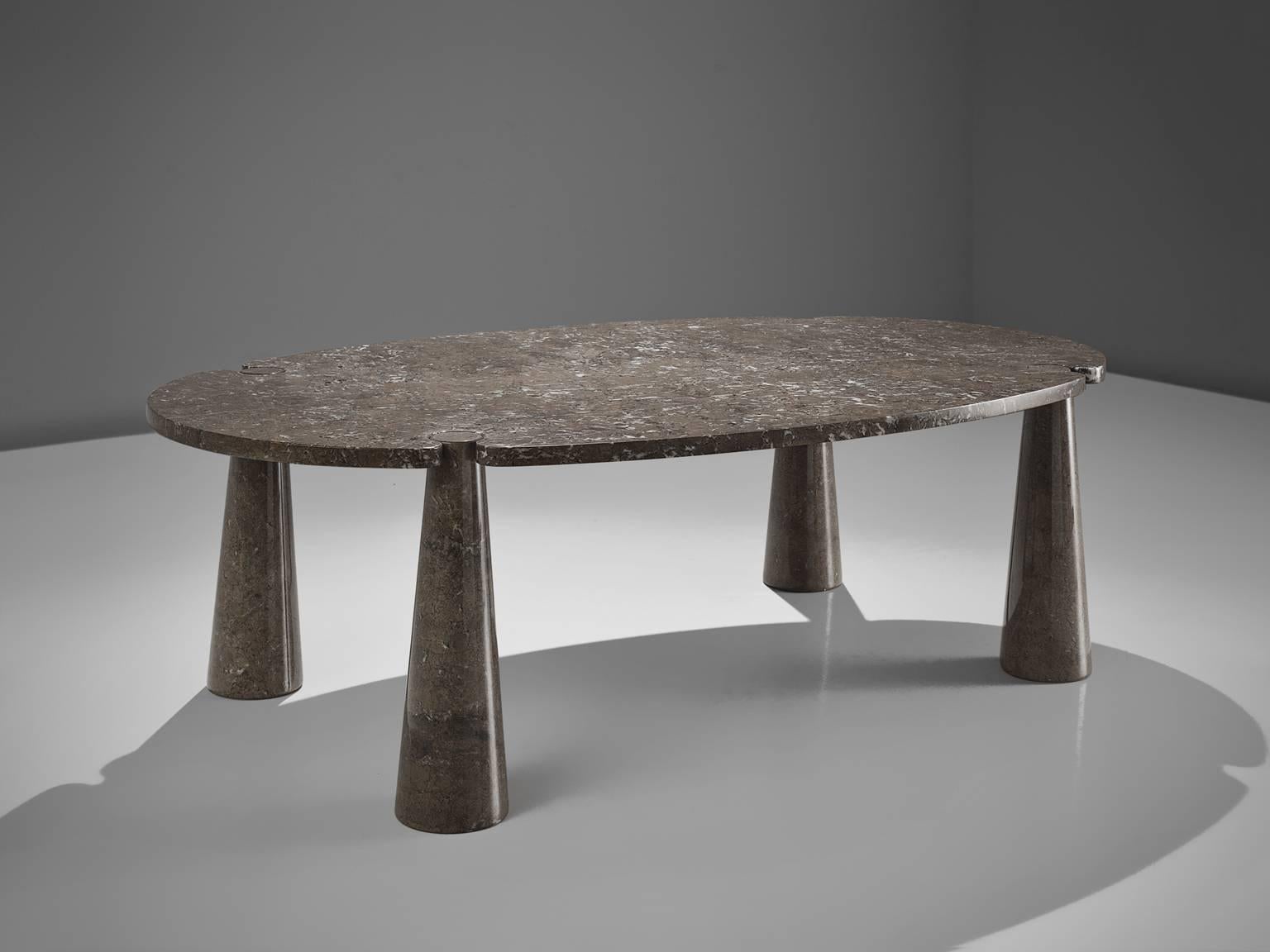 Angelo Mangiarotti, dining table, marble, 1970s. 

This sculptural table by Angelo Mangiarotti is a skillful example of postmodern design. The table is executed in grey marble. The oval table features no joints or clamps and is architectural in
